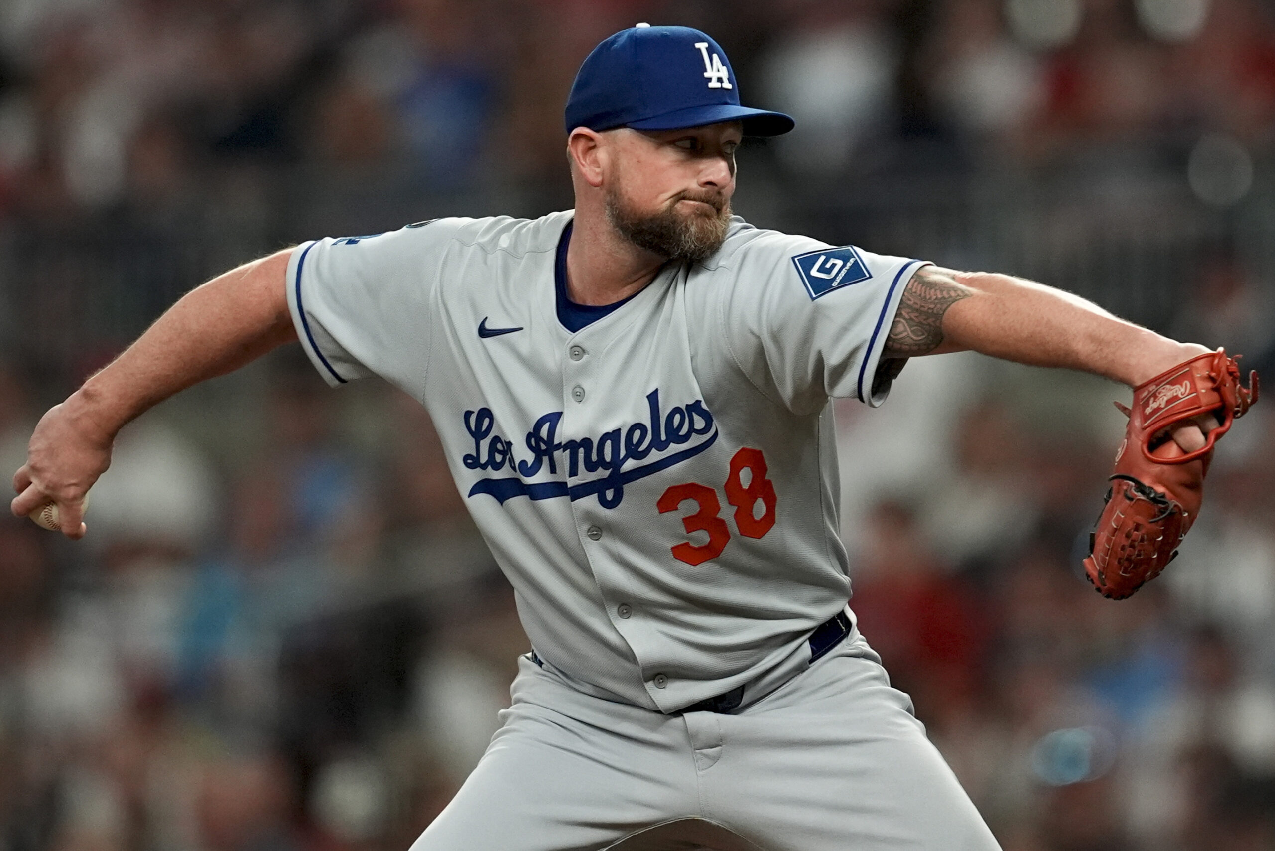 Dodgers relief pitcher Kirby Yates throws to the plate against...