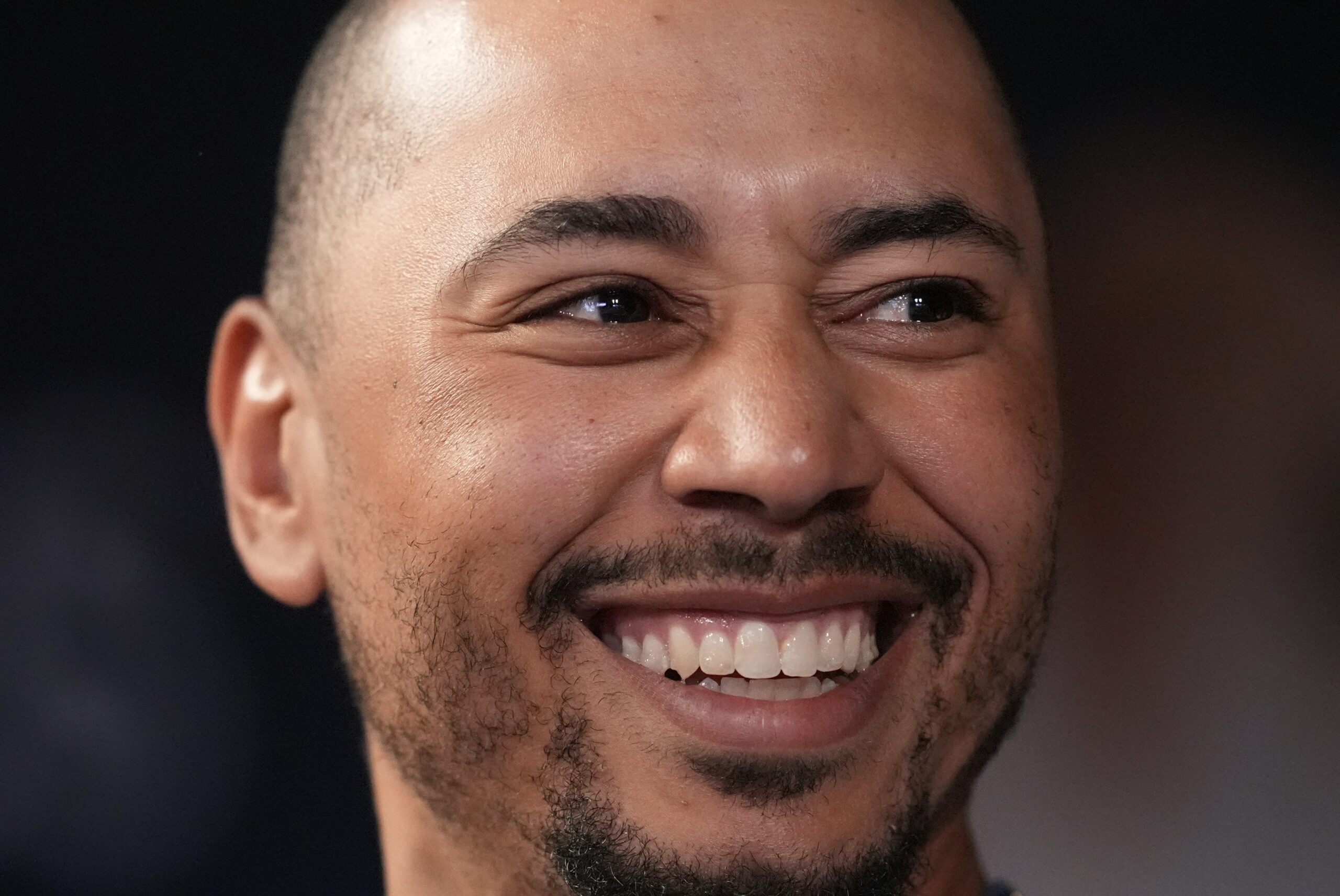 Dodgers shortstop Mookie Betts speaks with players in the eighth...