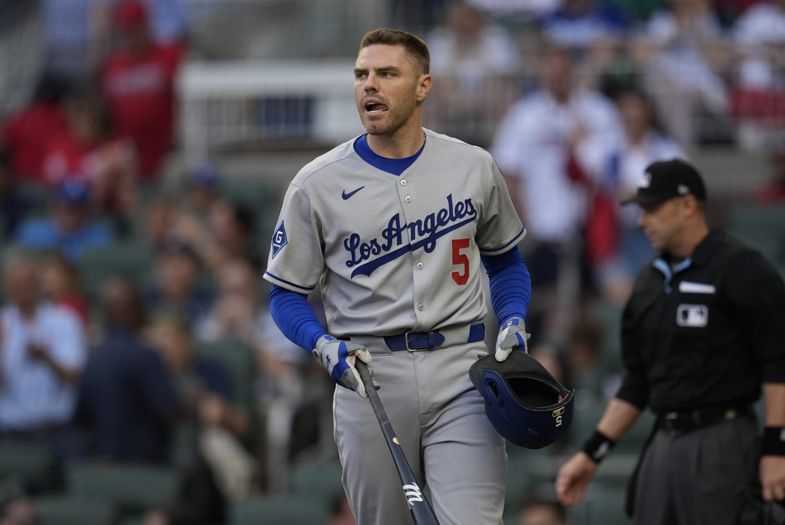 The Dodgers’ Freddie Freeman walks to the dugout after striking...