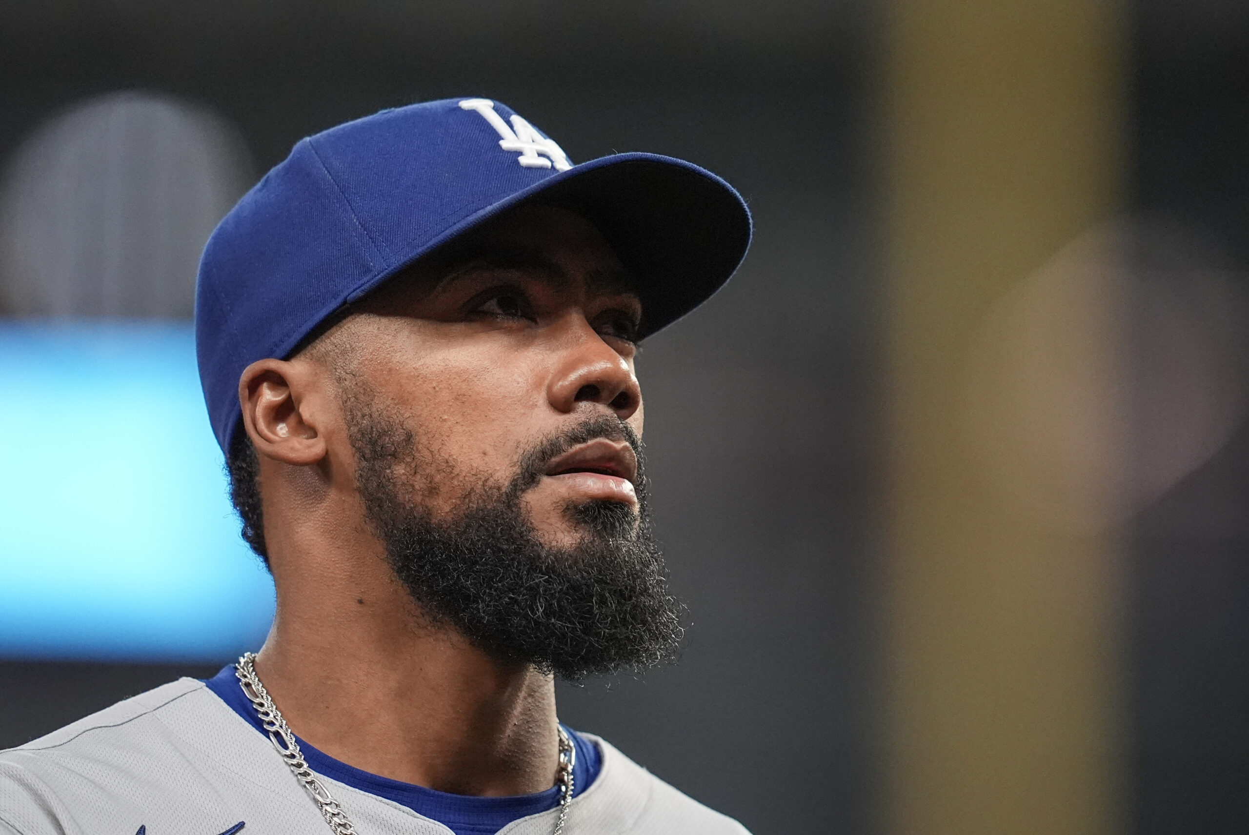 Dodgers outfielder Teoscar Hernández walks to the dugout in the...