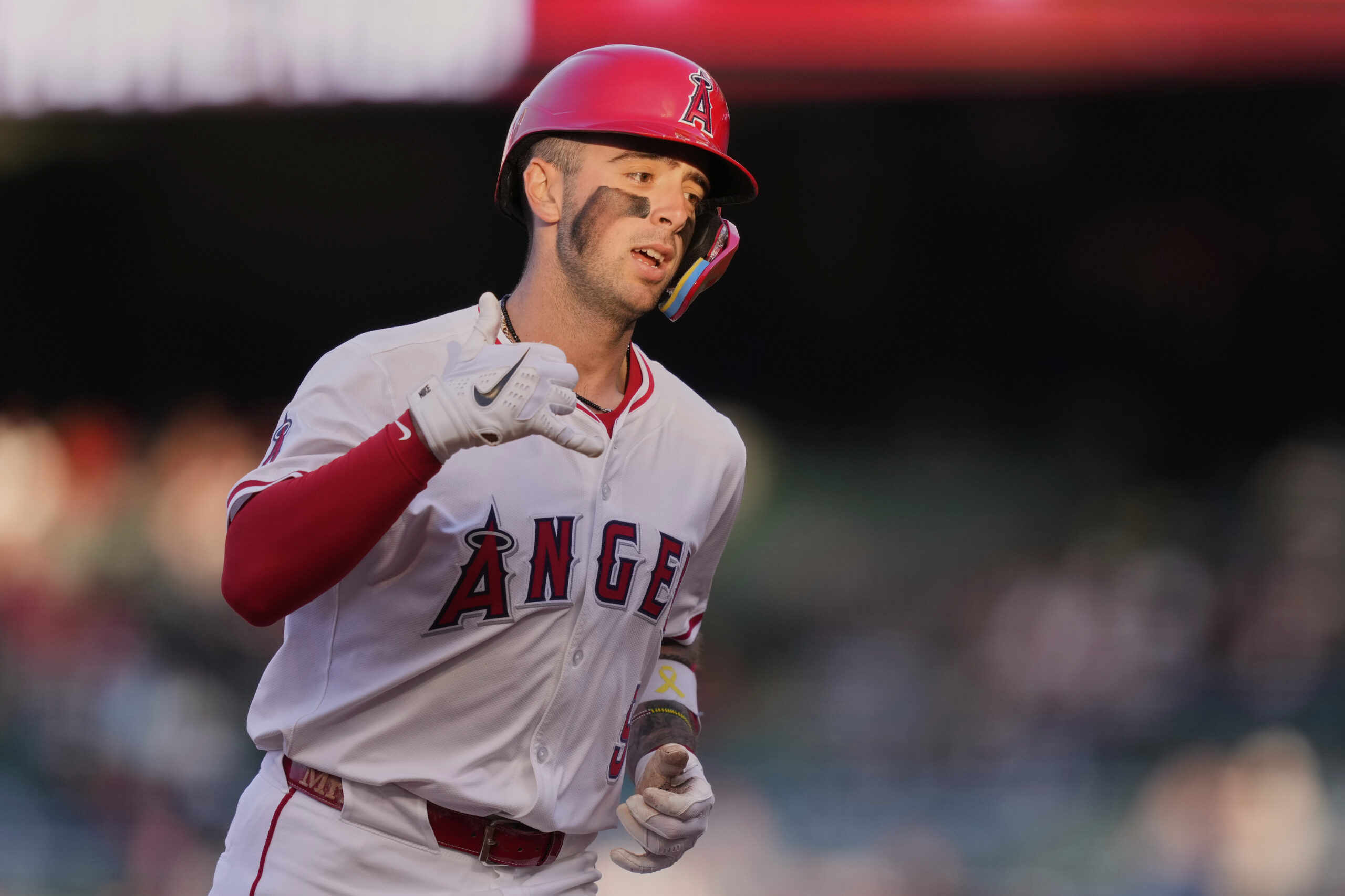 The Angels’ Zach Neto gestures after hitting a solo home...