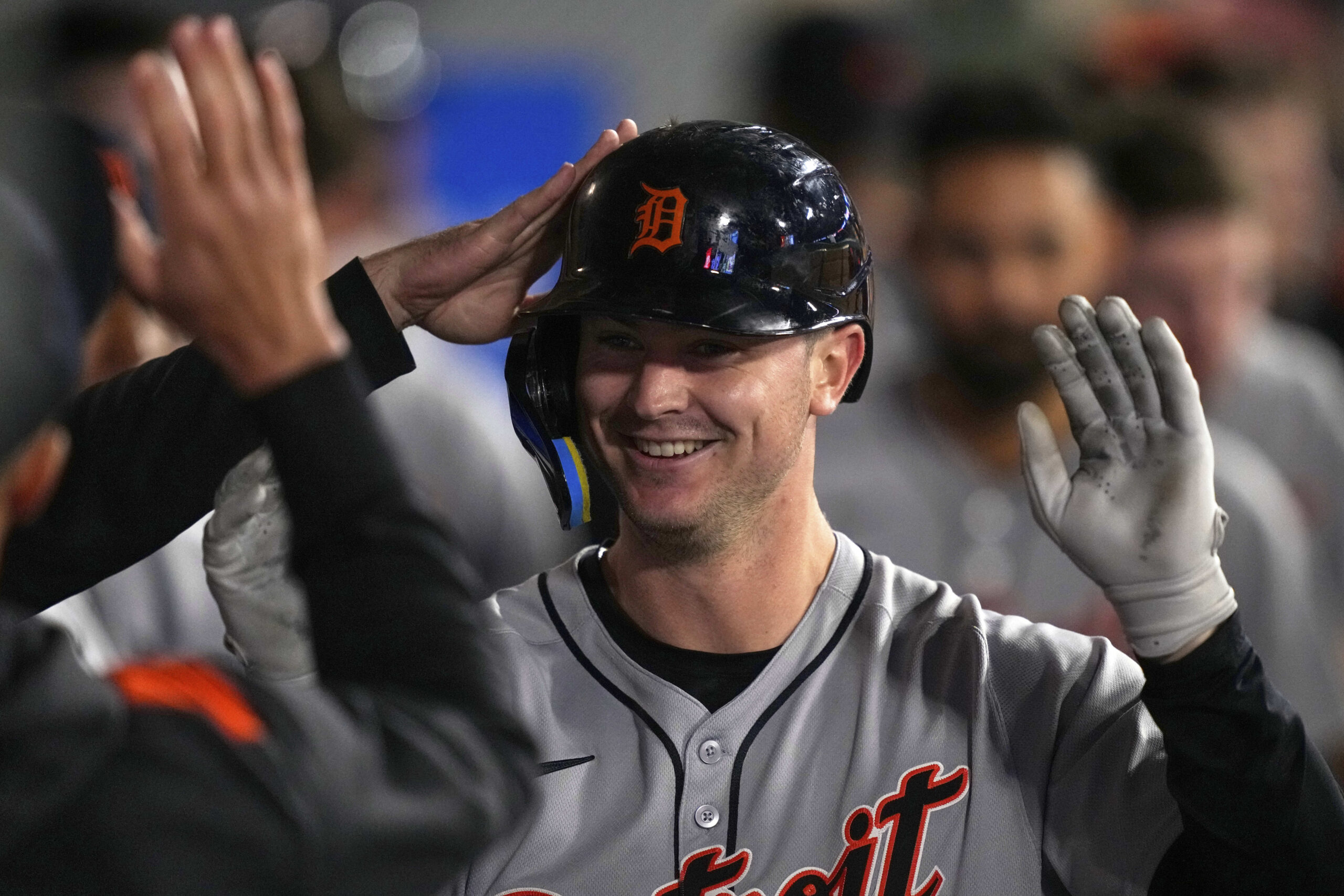 The Detroit Tigers’ Trey Sweeney is congratulated by teammates in...