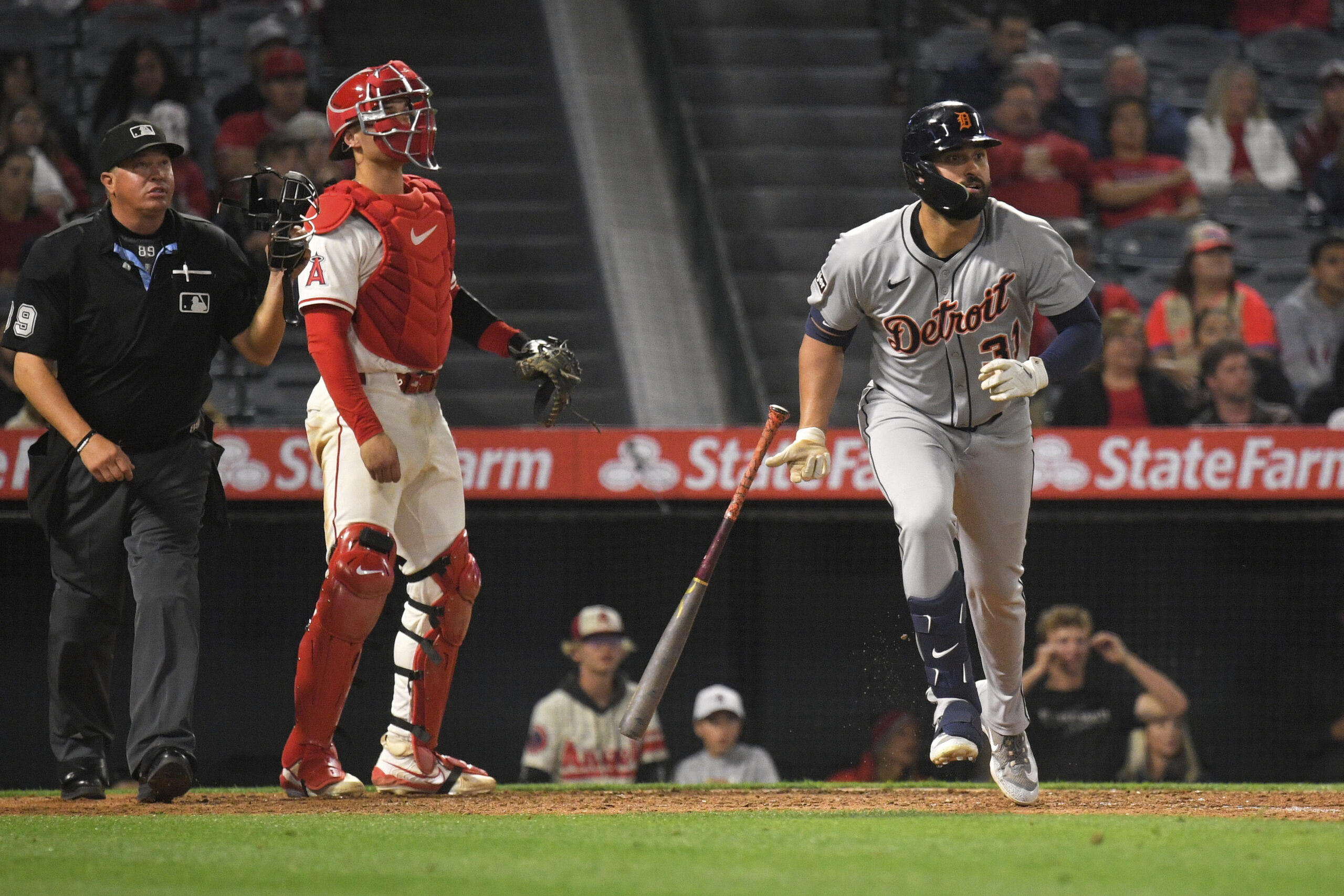 The Detroit Tigers’ Riley Greene, right, begins to run the...