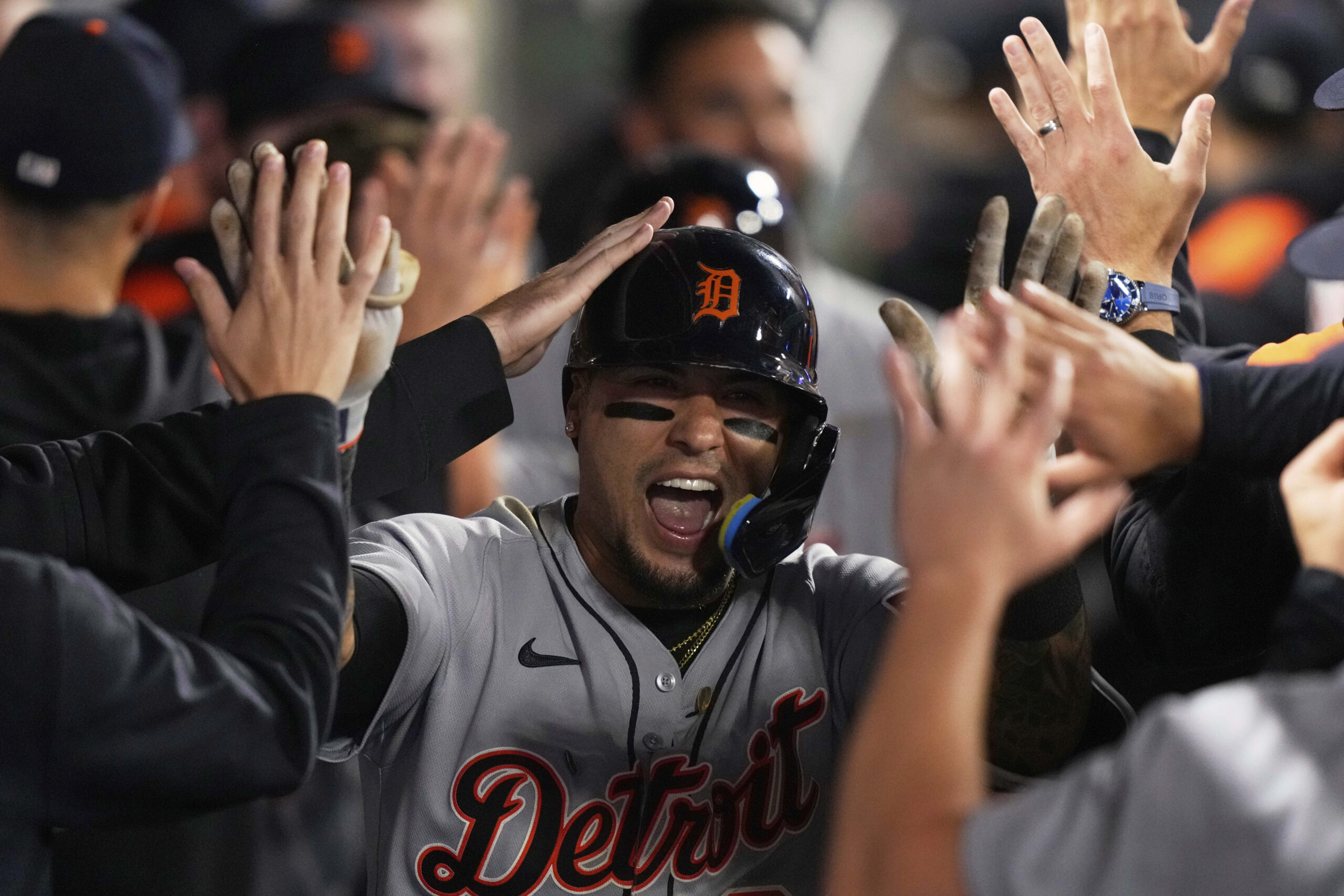 The Detroit Tigers’ Javy Baez is congratulated by teammates in...