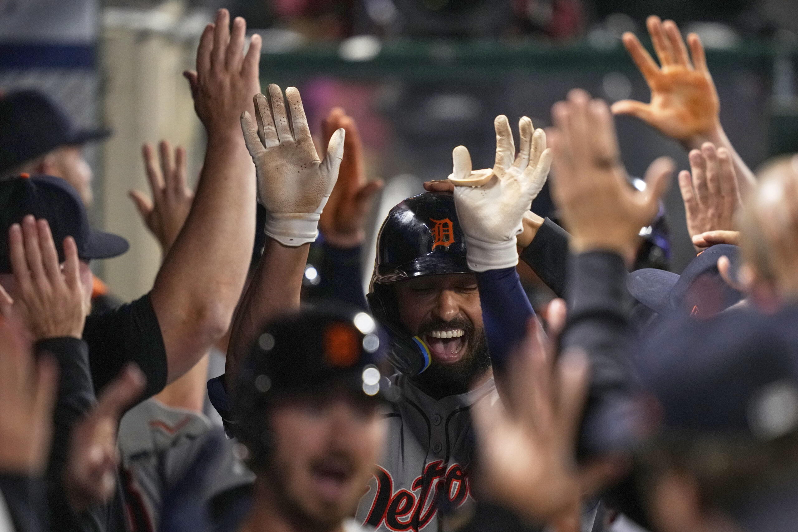 The Detroit Tigers’ Riley Greene is congratulated by teammates in...