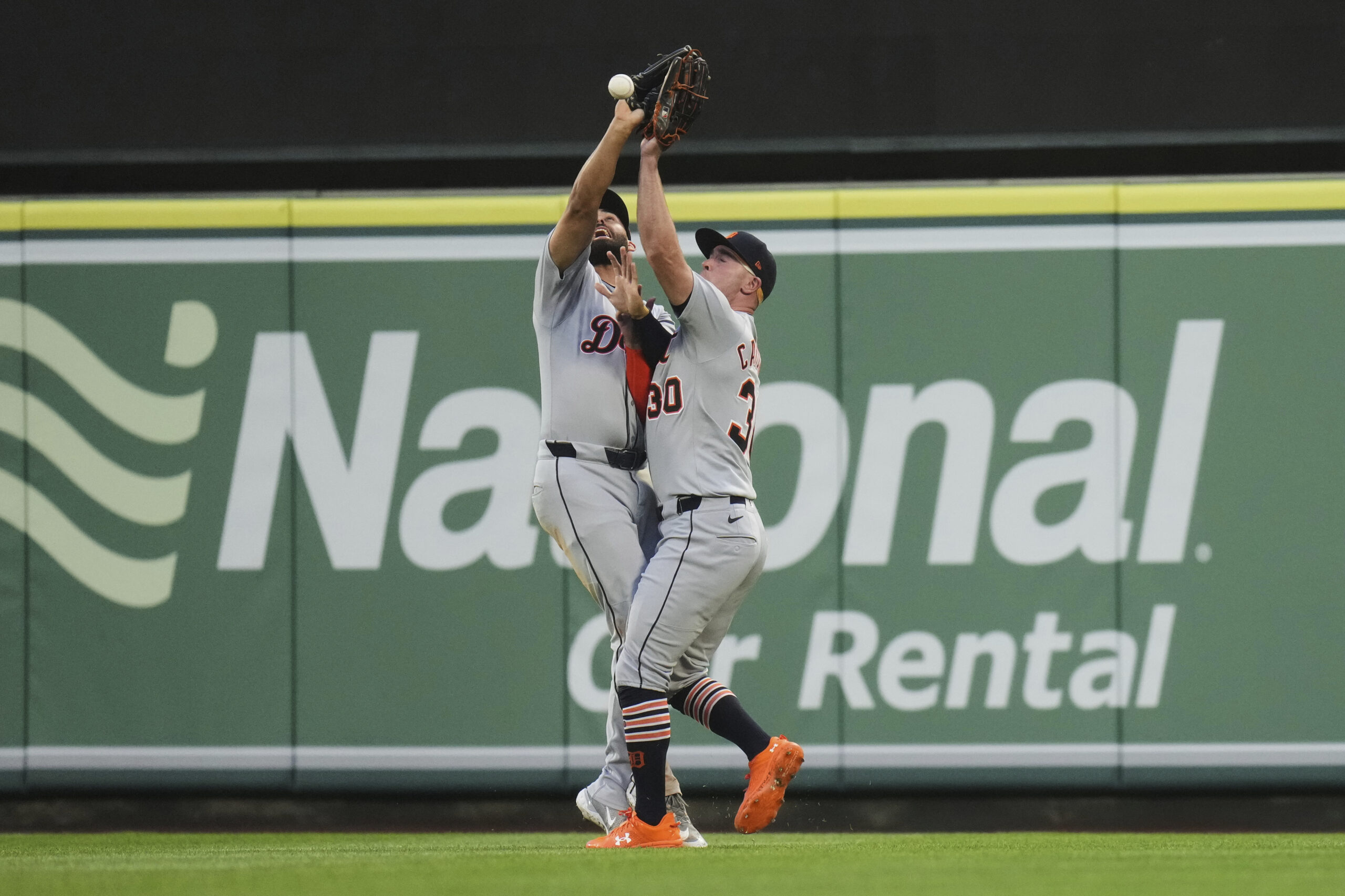 Detroit Tigers outfielders Riley Greene, left, and Kerry Carpenter collide...