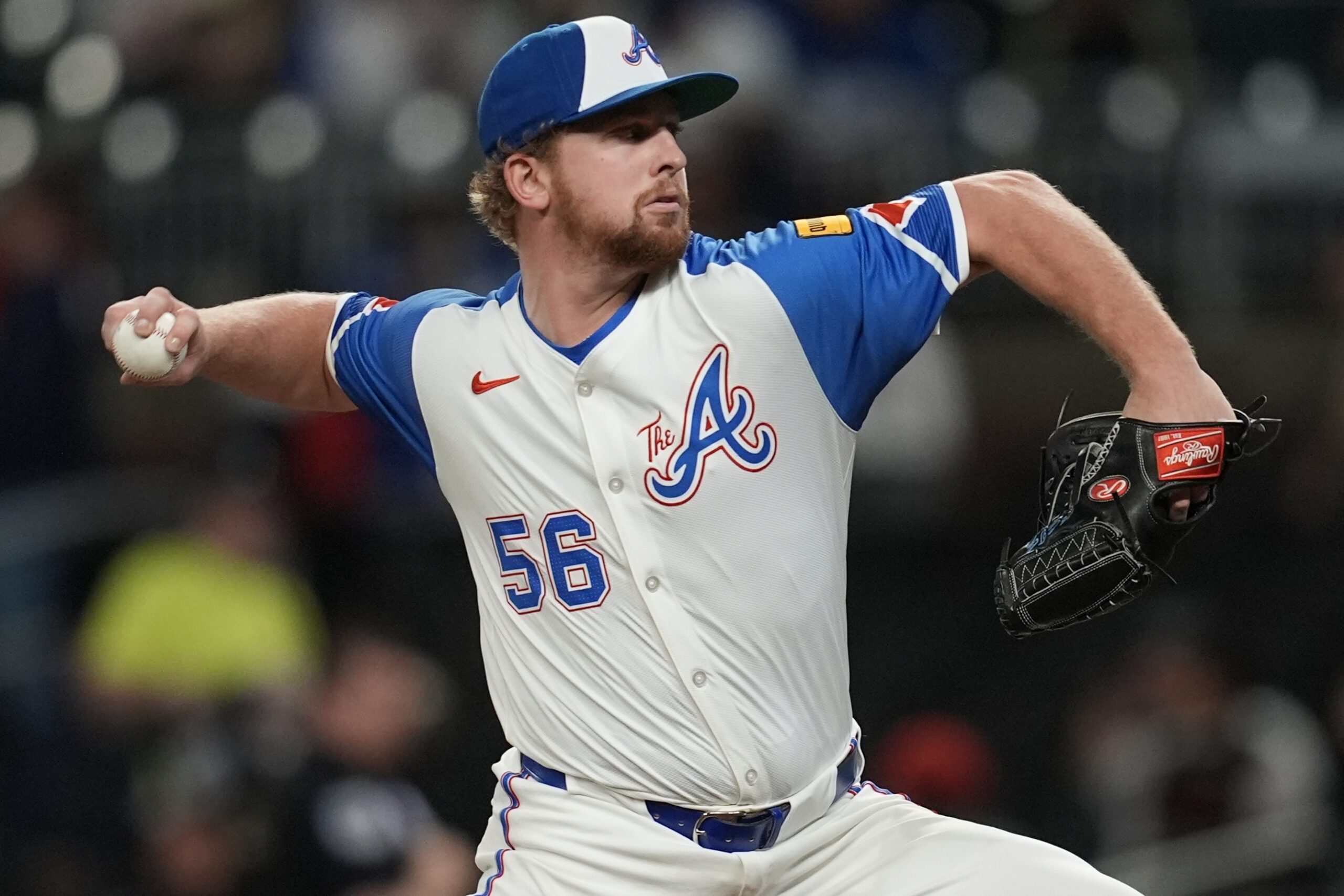 Atlanta Braves pitcher Spencer Schwellenbach throws to the plate against...