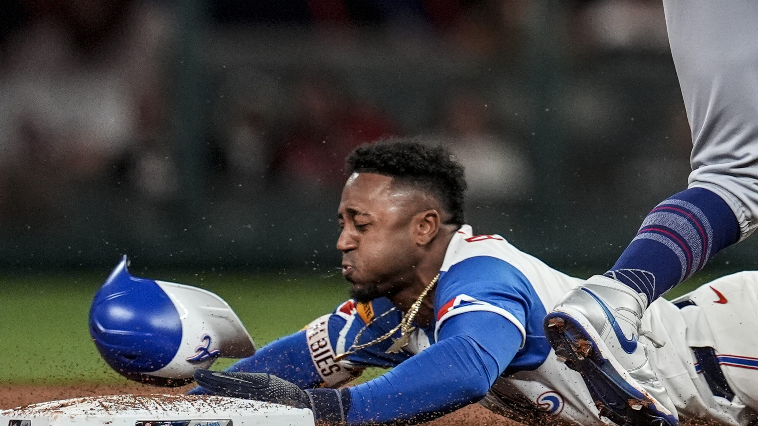 The Atlanta Braves’ Ozzie Albies steals second base in front...