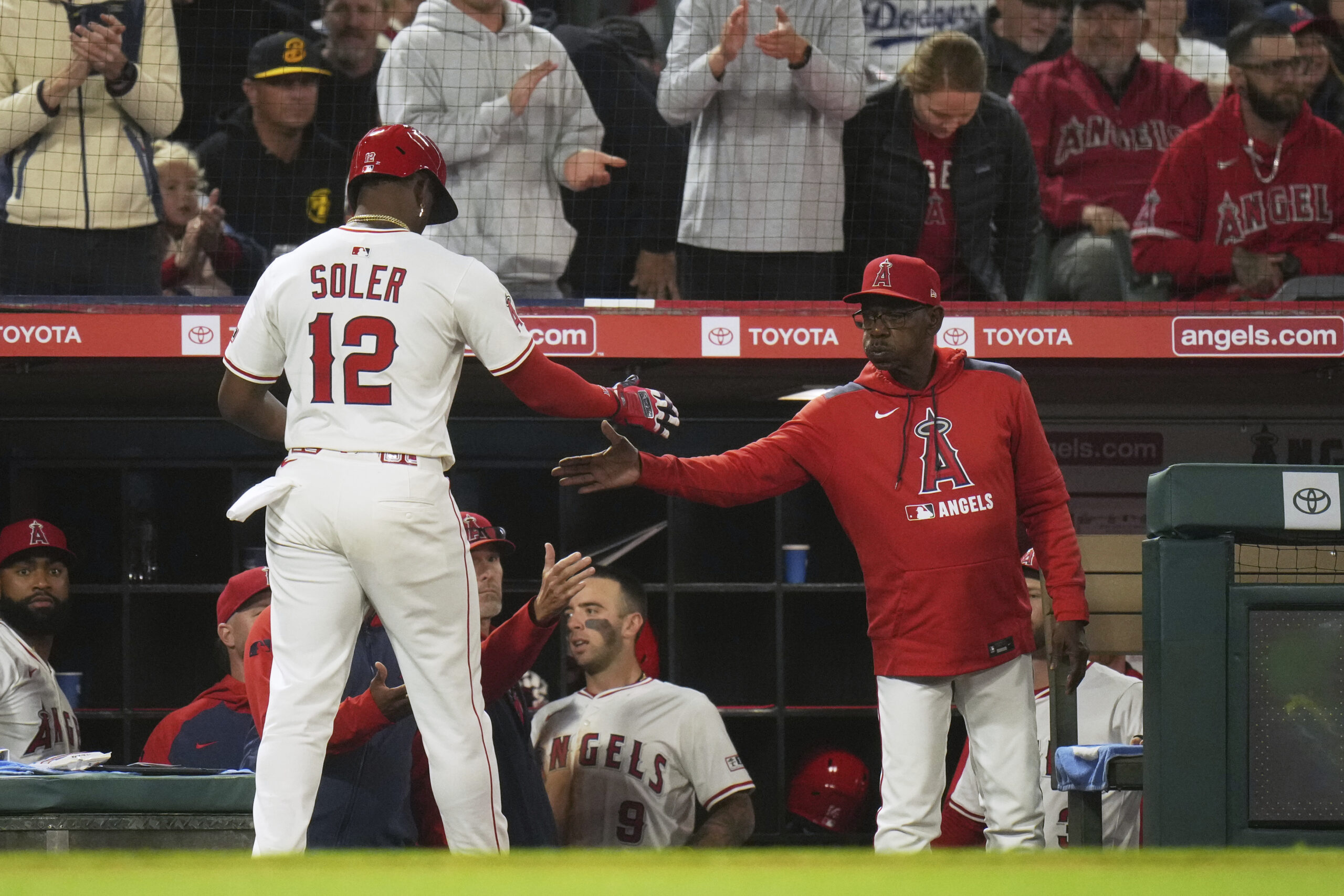 The Angels’ Jorge Soler, left, is greeted by Manager Ron...