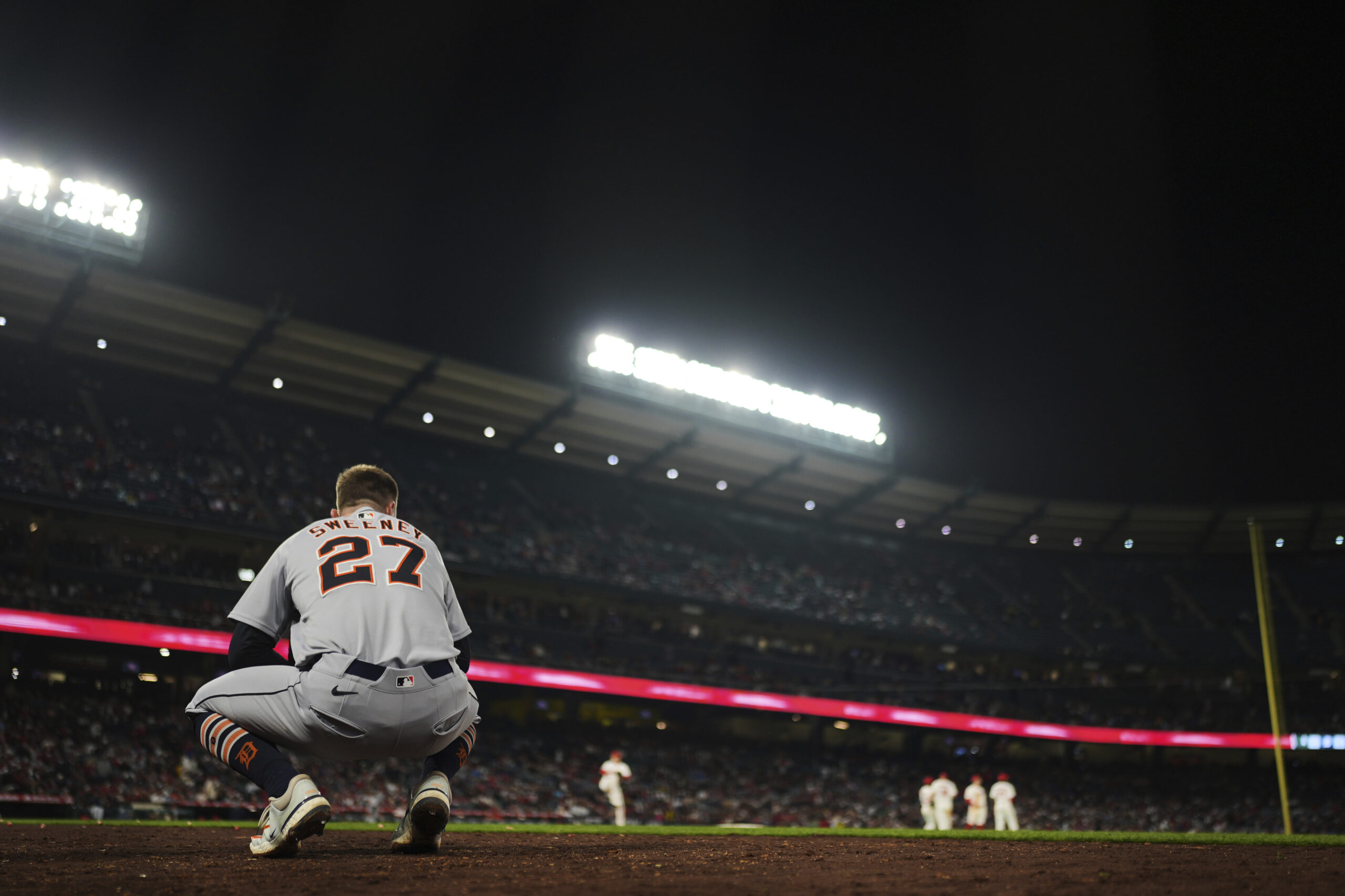 The Detroit Tigers’ Trey Sweeney (27) waits near the dugout...