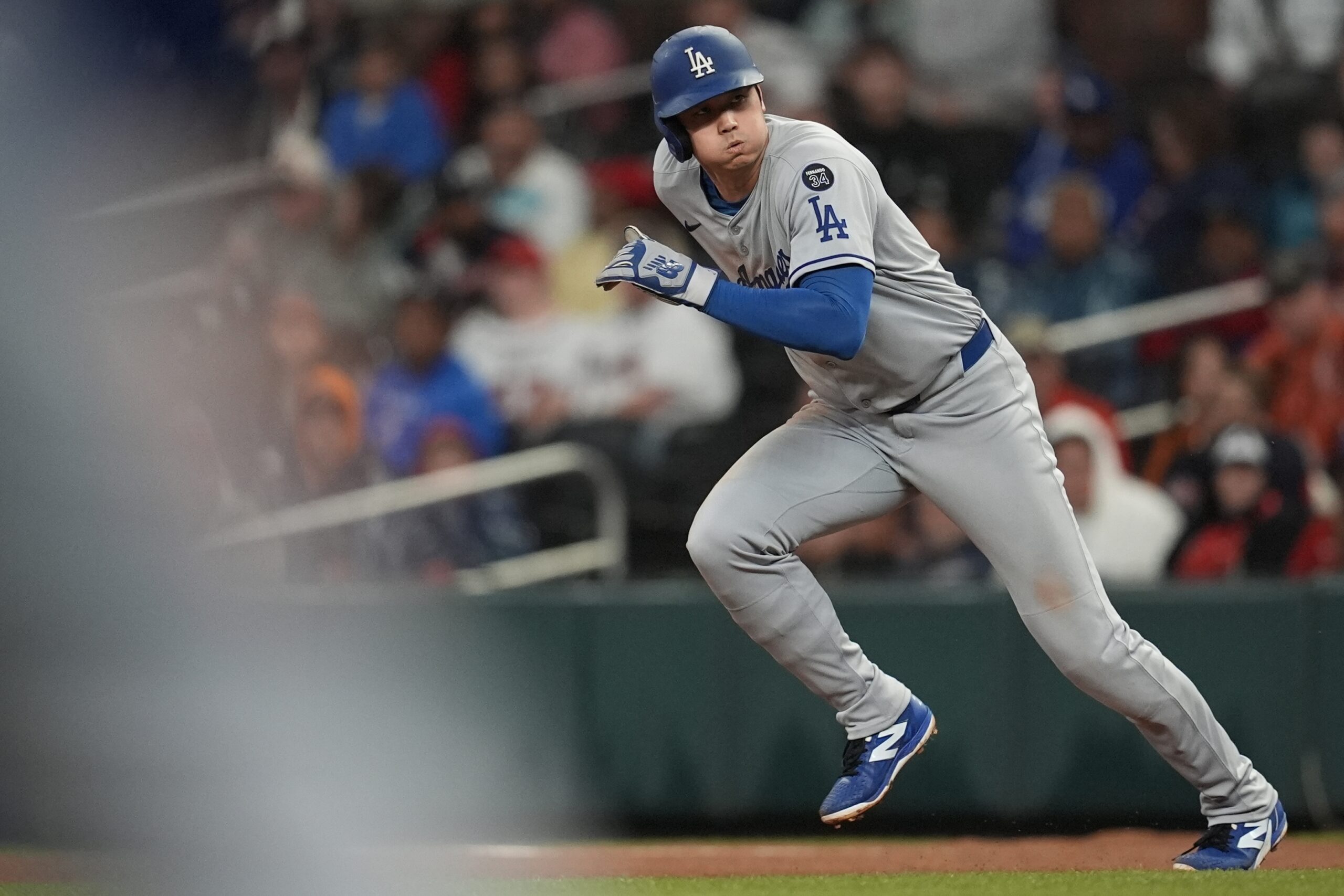 Dodgers star Shohei Ohtani runs to second against the Atlanta...