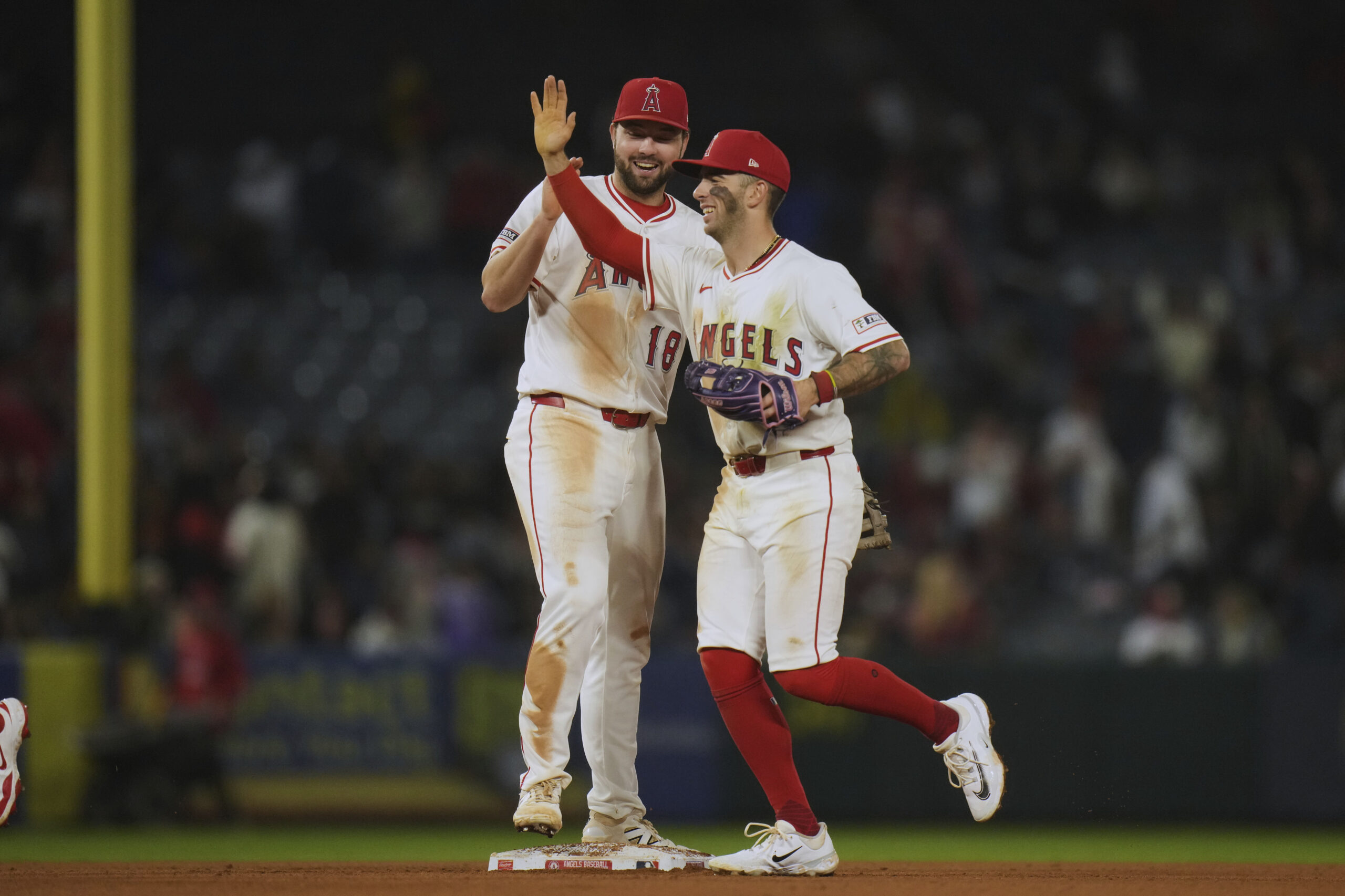 Angels first baseman Nolan Schanuel, left, and shortstop Zach Neto...