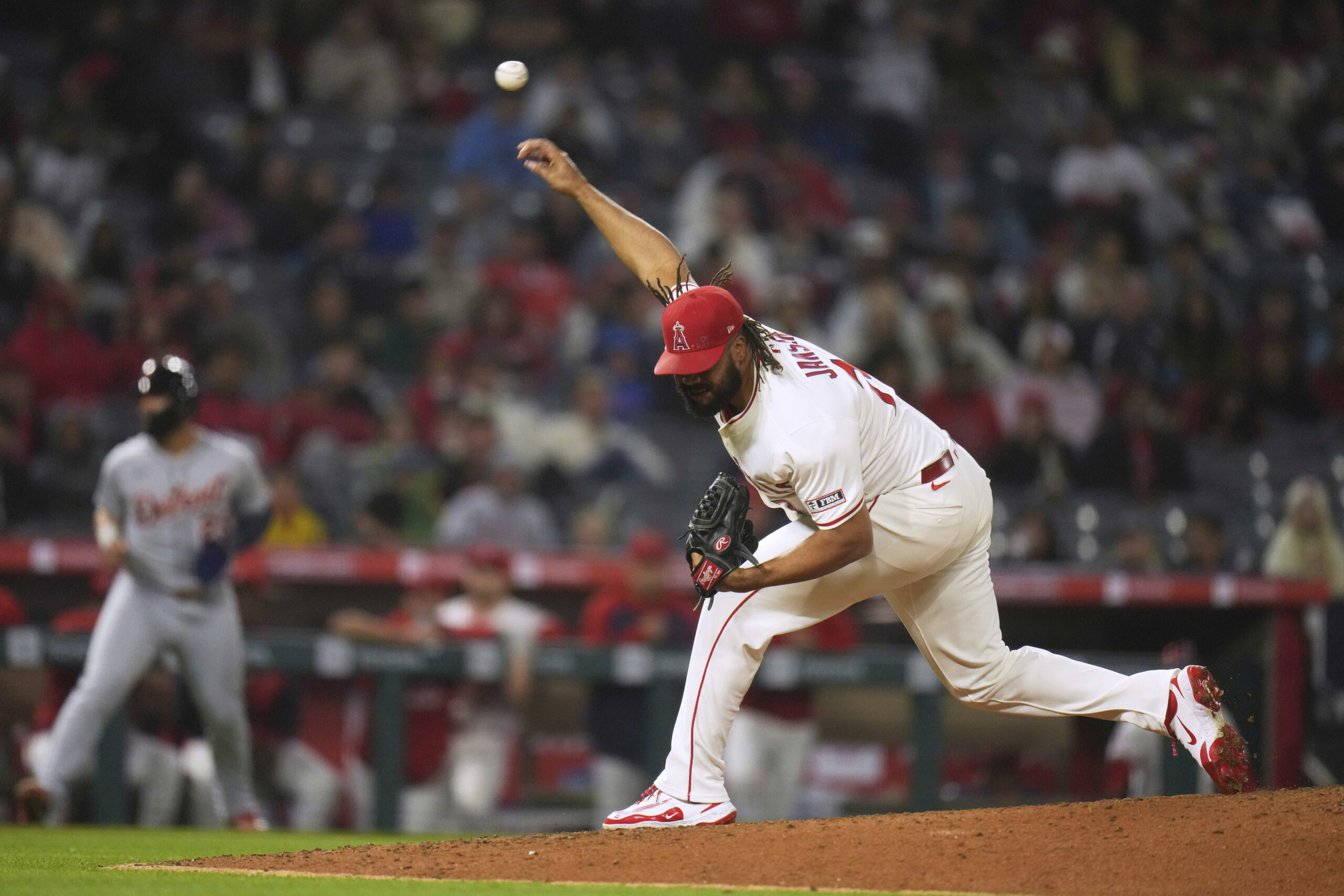 Angels relief pitcher Kenley Jansen throws to the plate against...