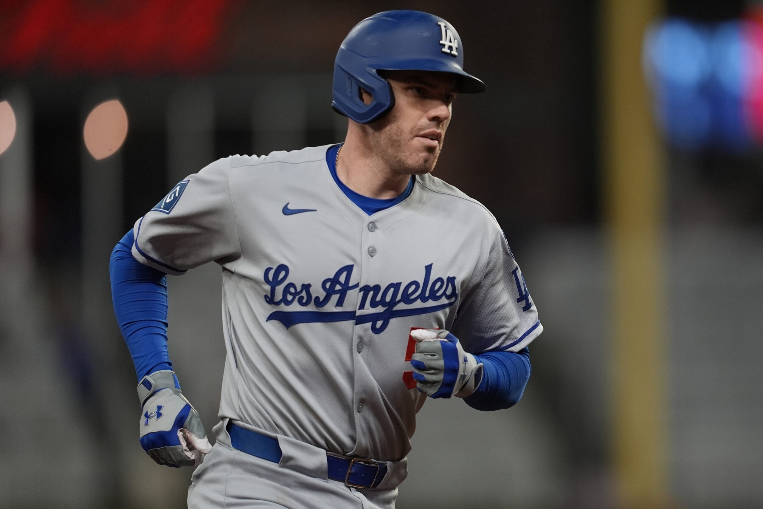 The Dodgers’ Freddie Freeman runs the bases after hitting a...