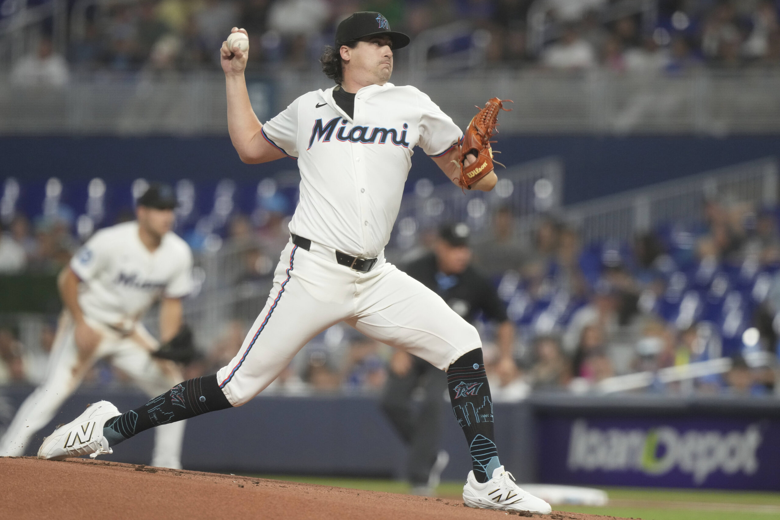 Miami Marlins starting pitcher Cal Quantrill throws to the plate...