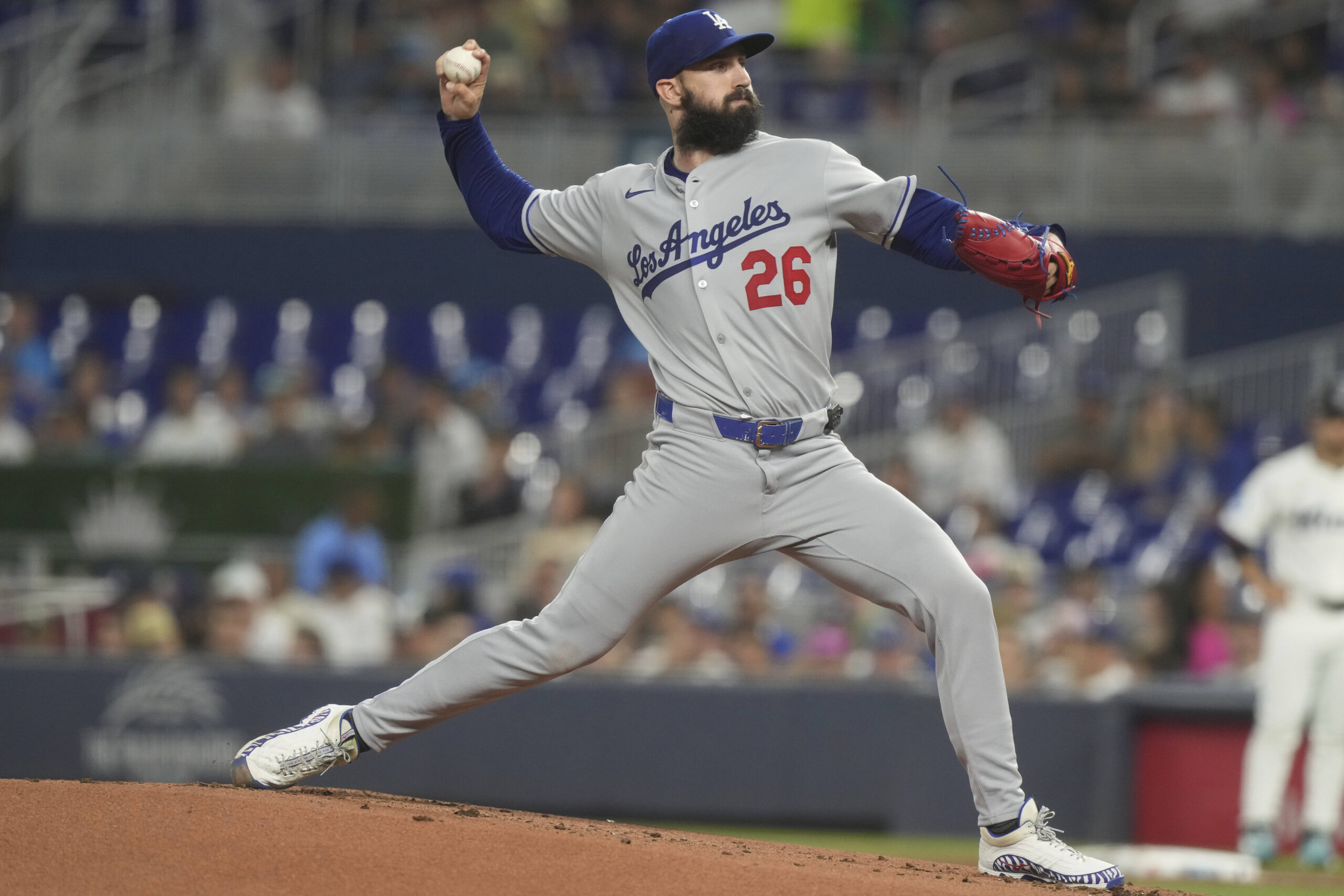 Dodgers starting pitcher Tony Gonsolin throws to the plate during...