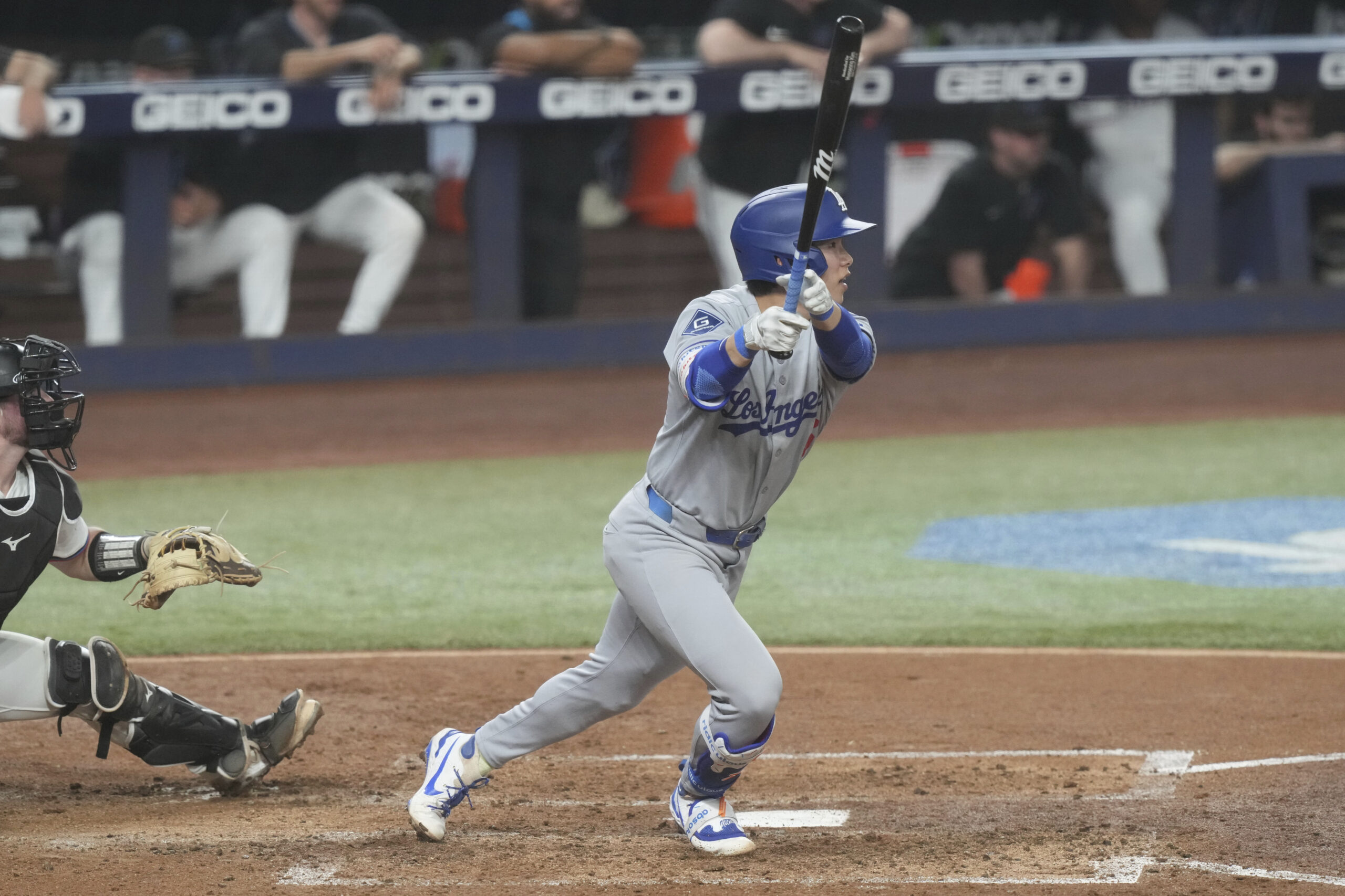 The Dodgers’ Hyeseong Kim hits a single during the fifth...