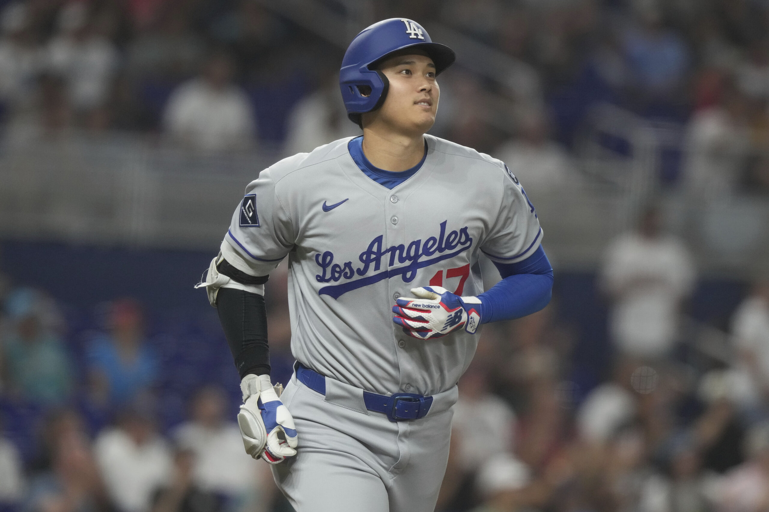 Dodgers star Shohei Ohtani runs the bases after hitting a...
