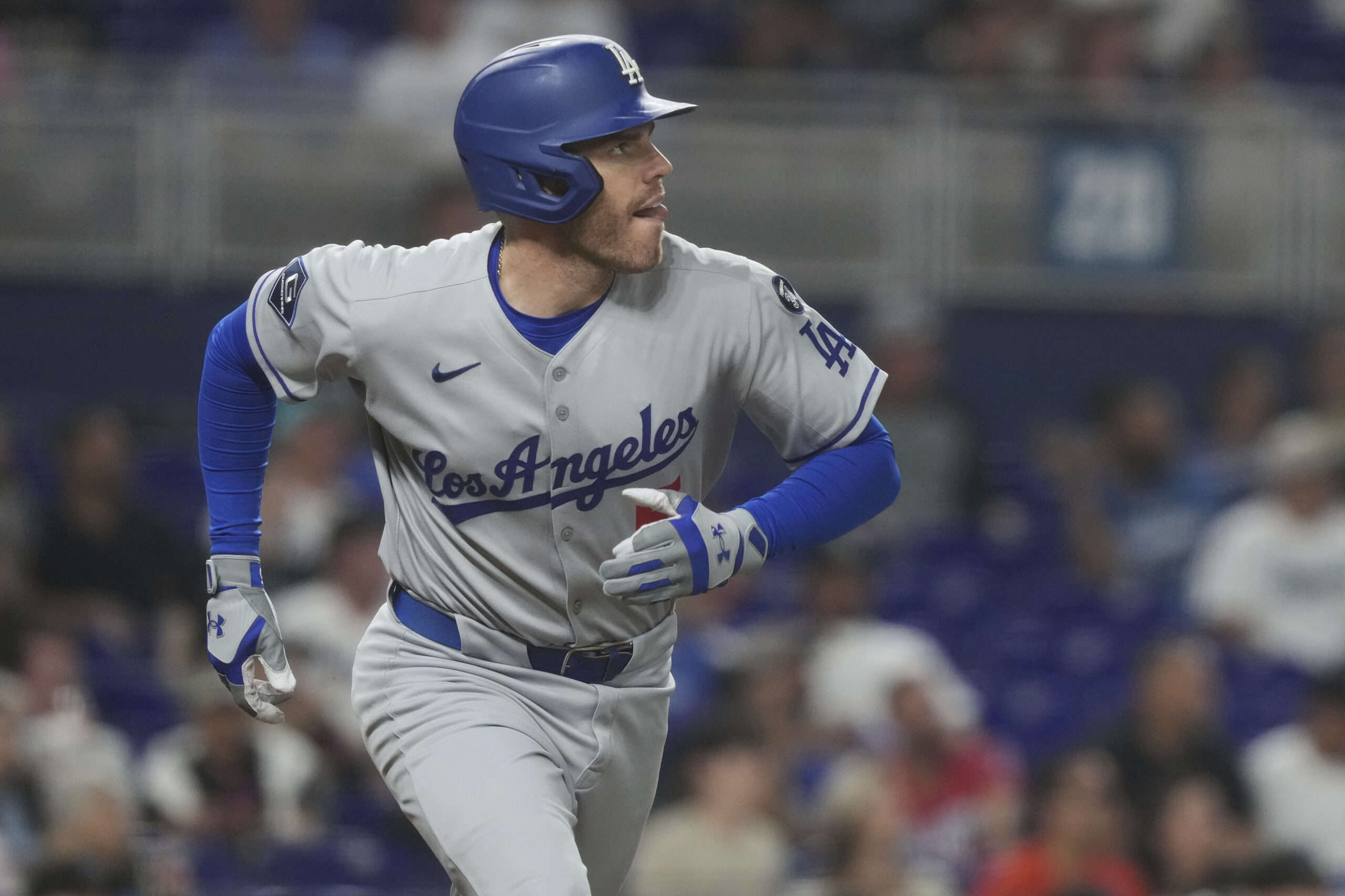 The Dodgers’ Freddie Freeman begins to run the bases as...