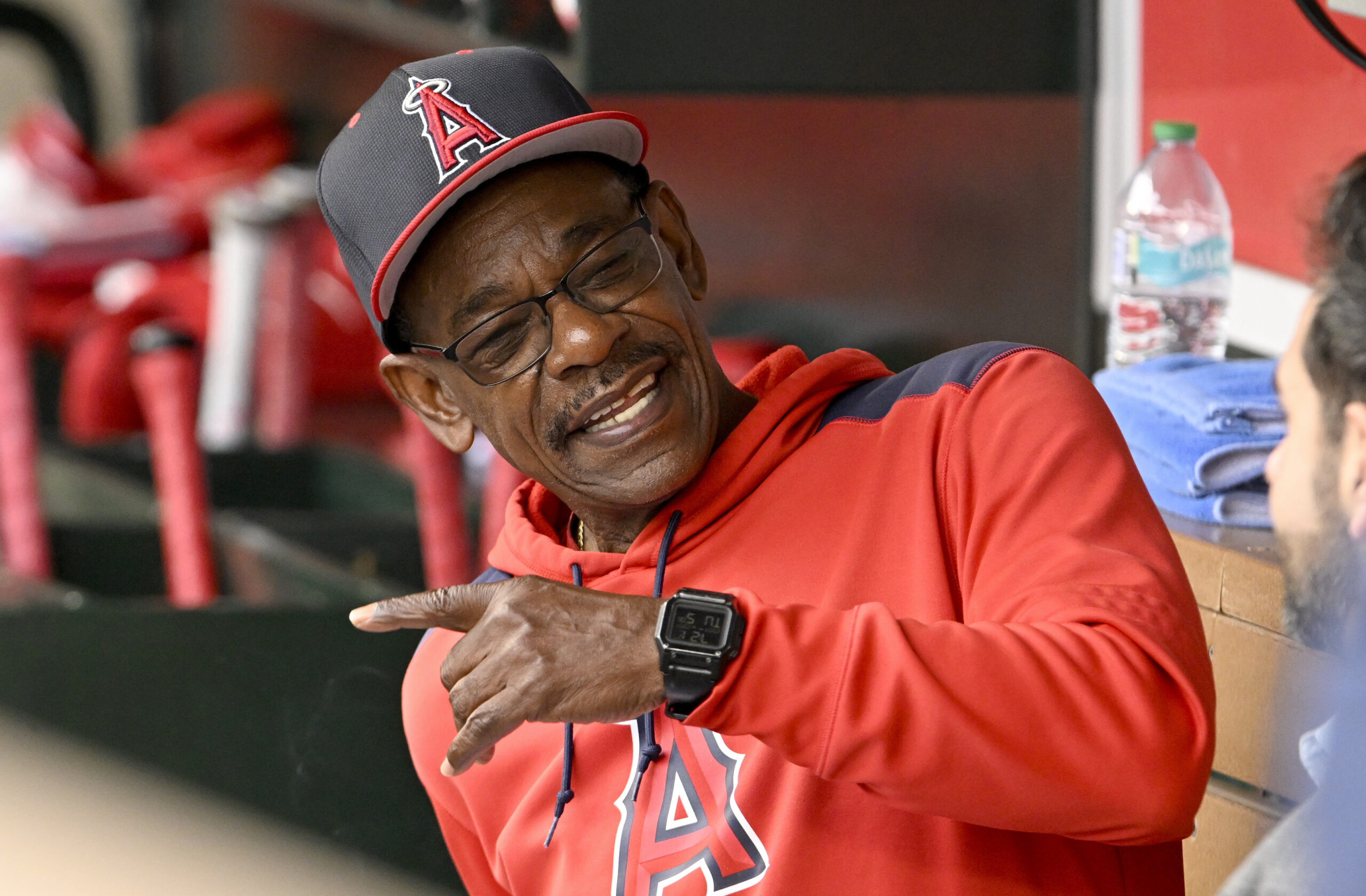 Angels manager Ron Washington talks in the dugout before their...