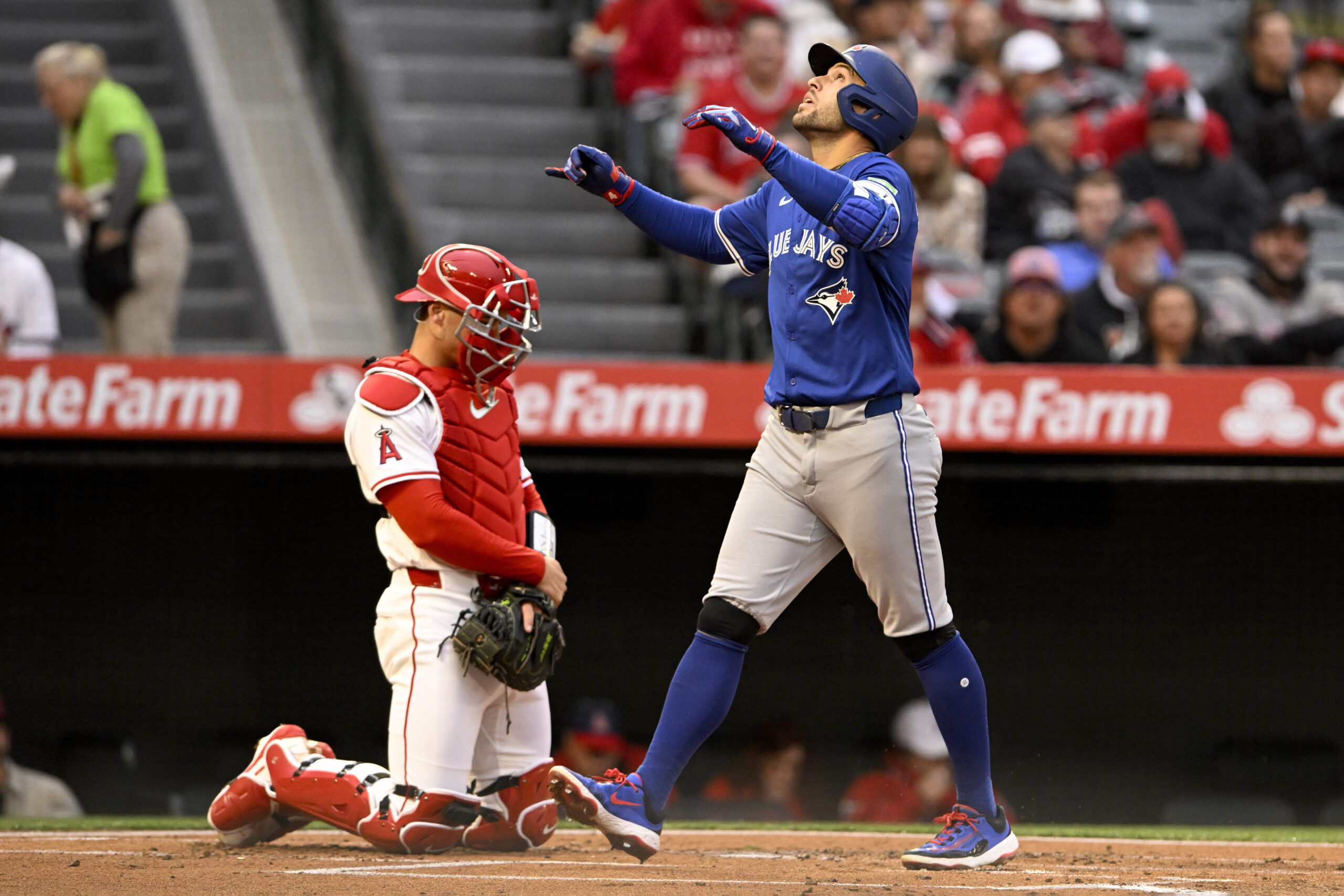 The Toronto Blue Jays’ George Springer gestures as he crosses...