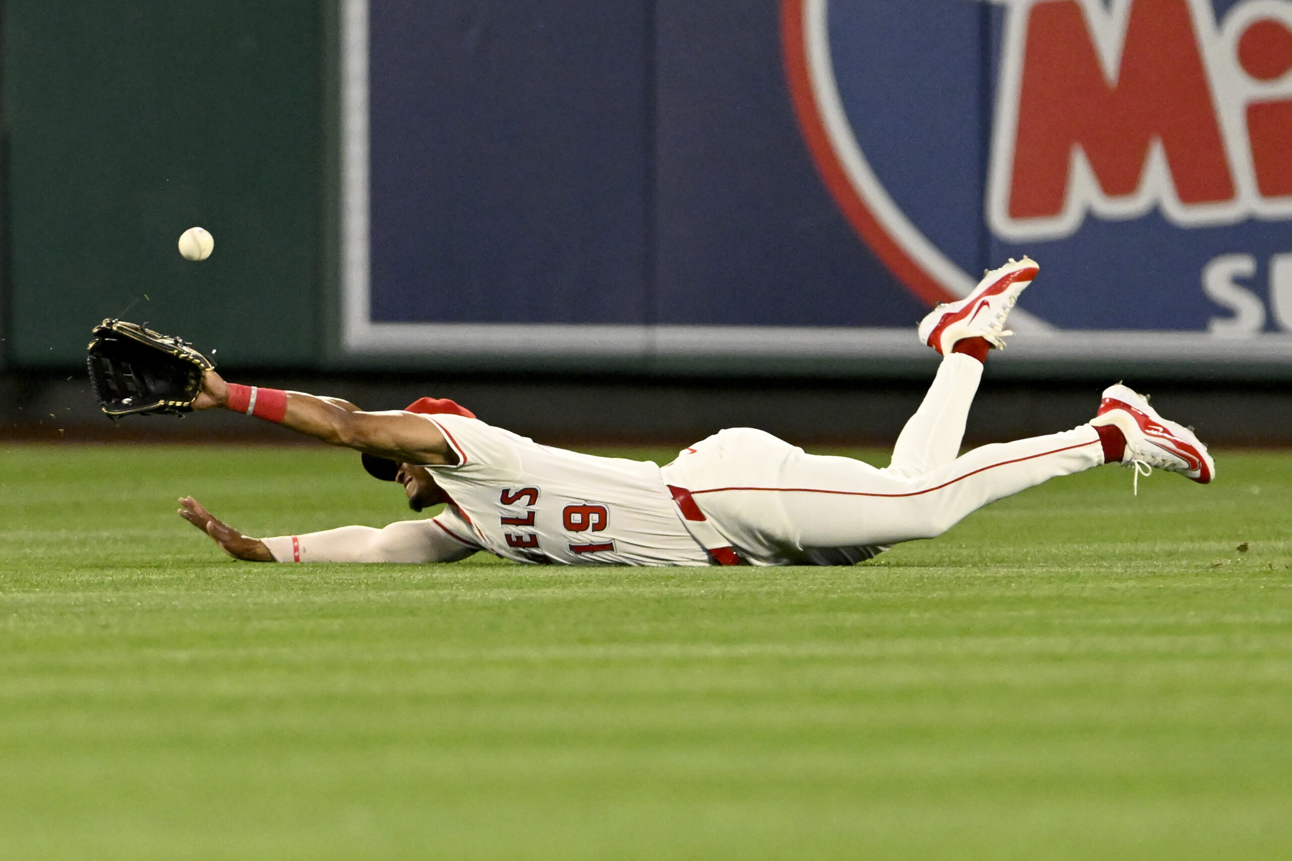 Angels center fielder Kyren Paris dives but can’t make the...