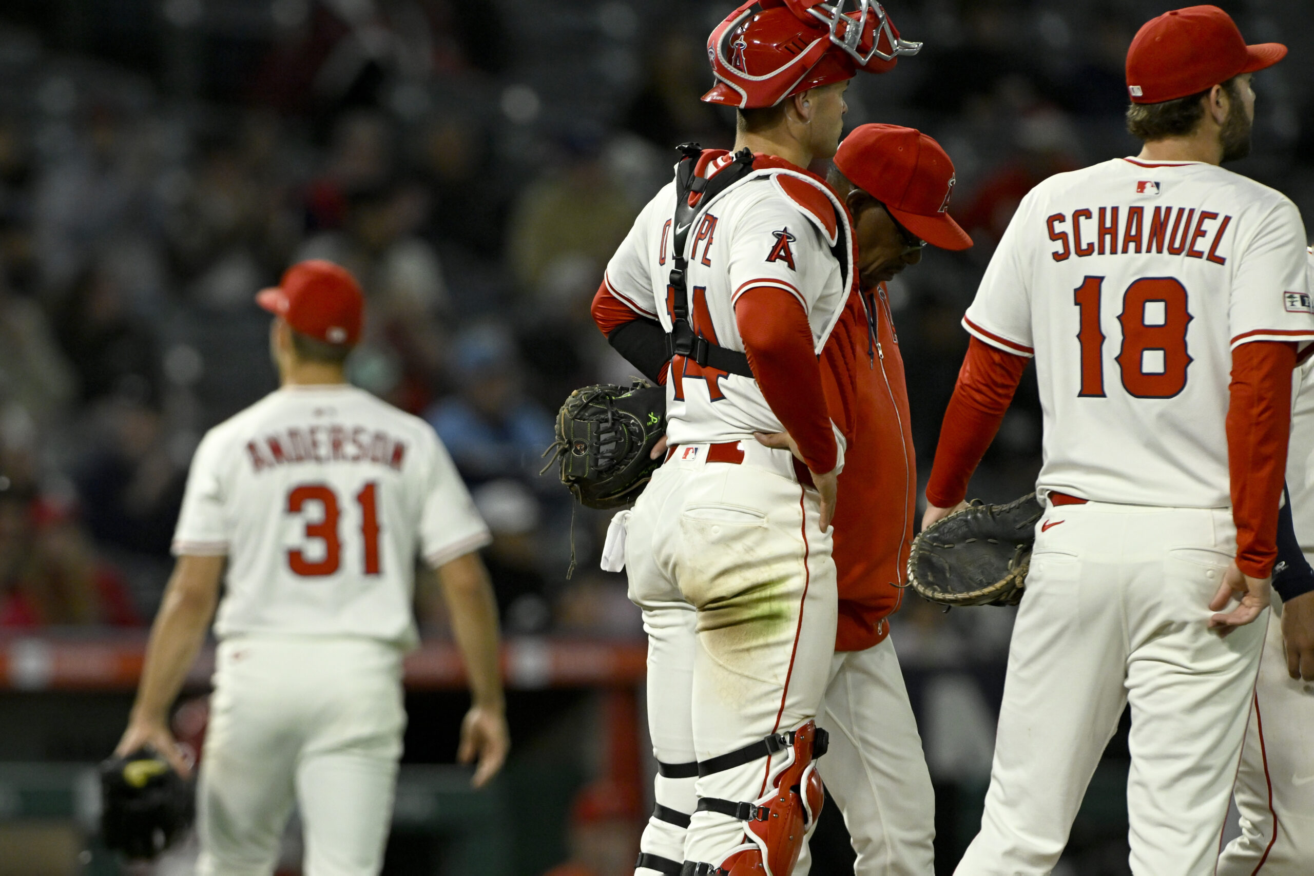 Angels manager Ron Washington, second from right, stands on the...