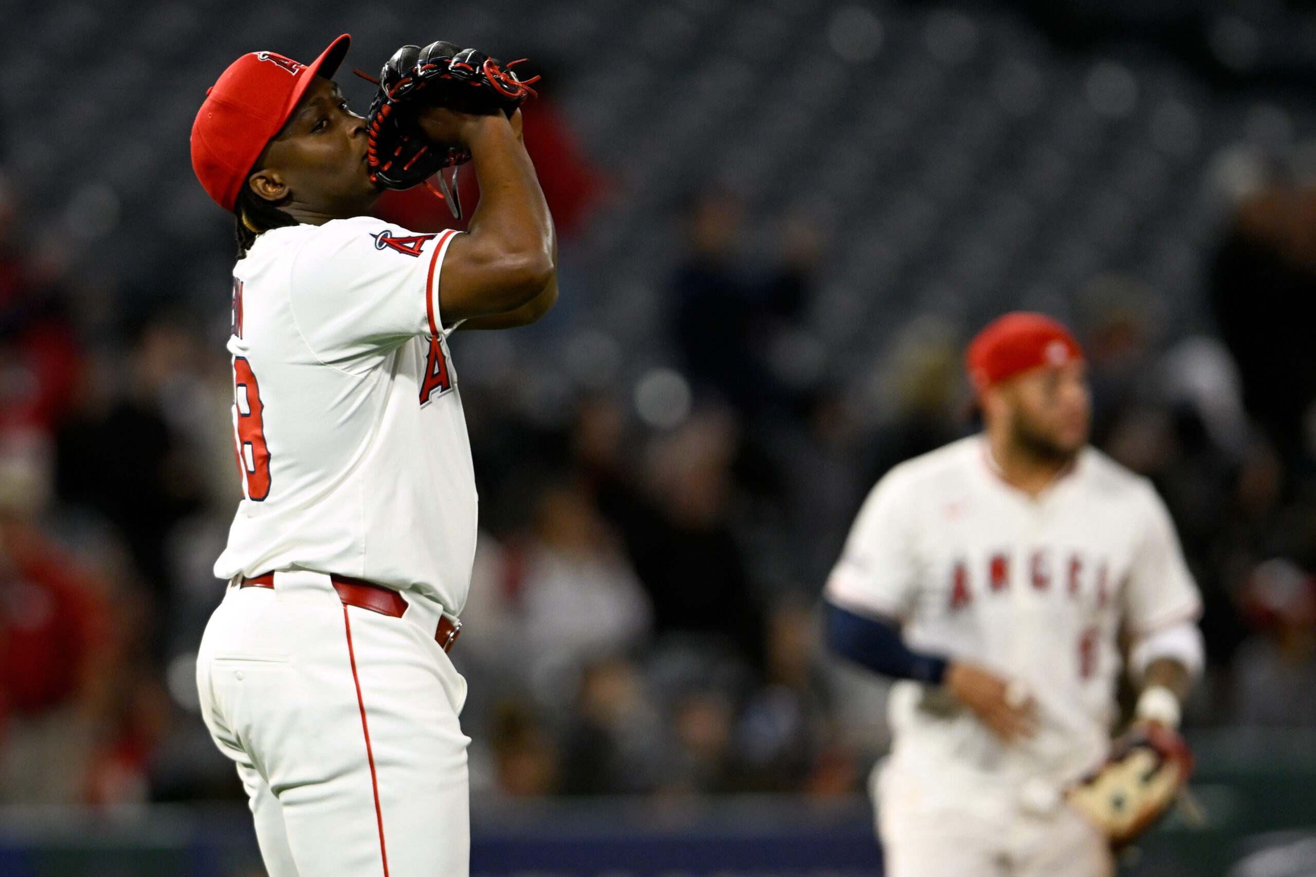 Angels relief pitcher Jose Fermin celebrates after the final out...
