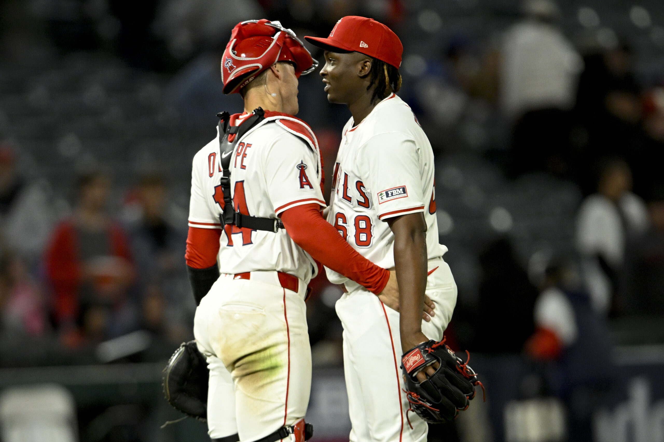 Angels catcher Logan O’Hoppe, left, congratulates relief pitcher Jose Fermin...
