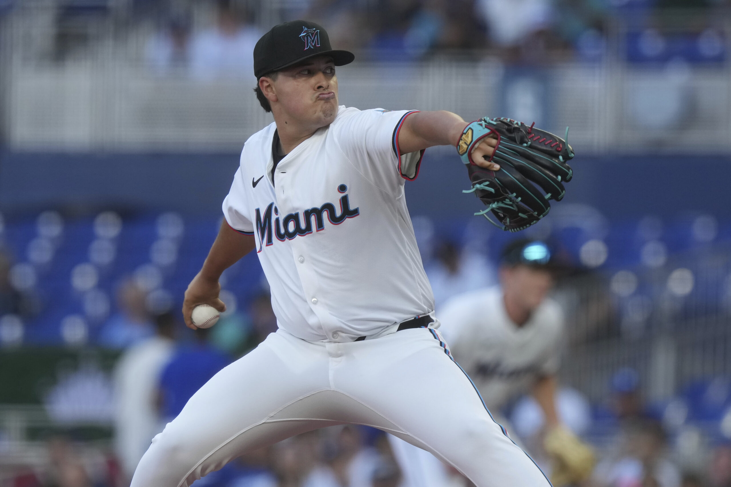 Miami Marlins starting pitcher Valente Bellozo throws to the plate...