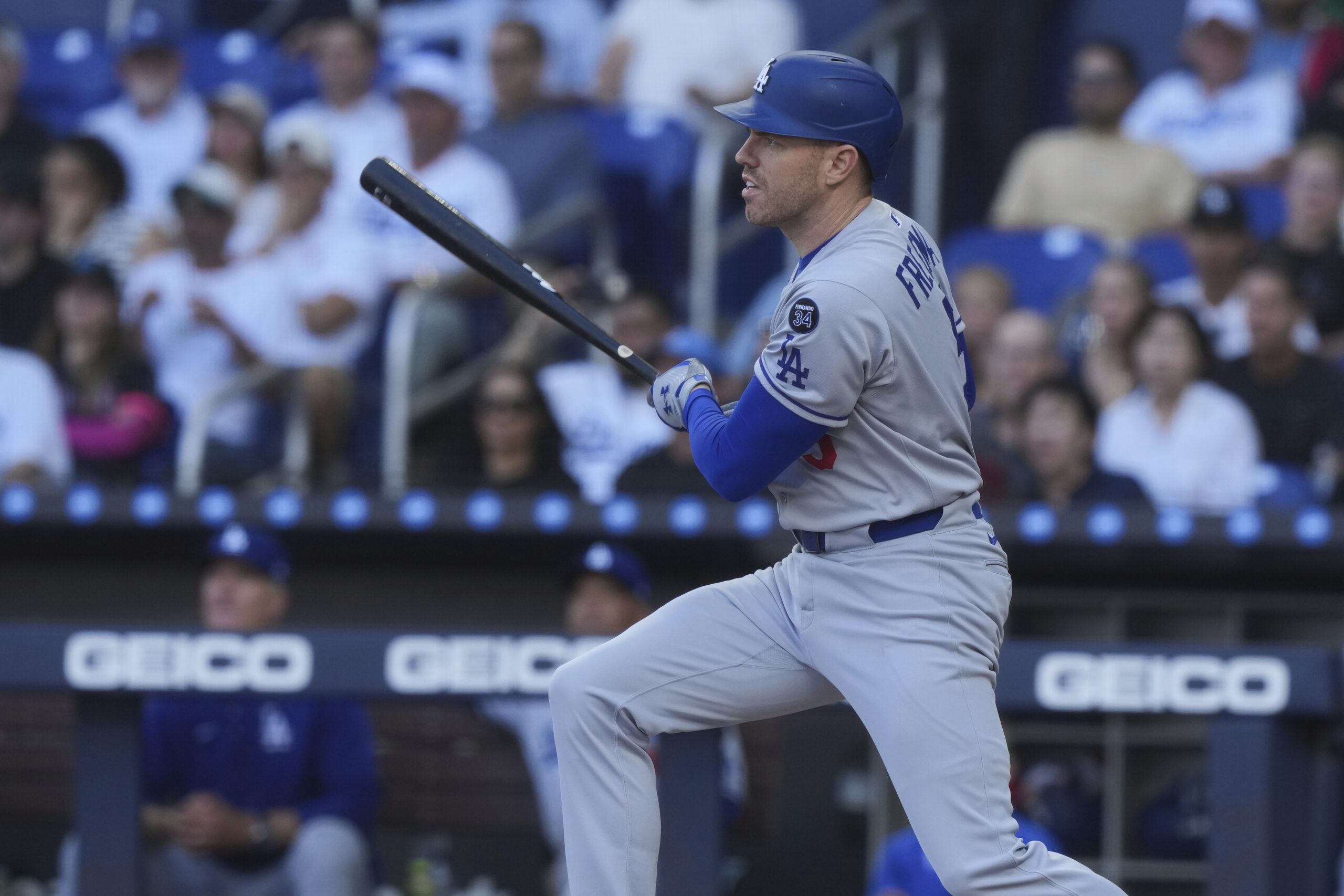 The Dodgers’ Freddie Freeman hits a single during the first...