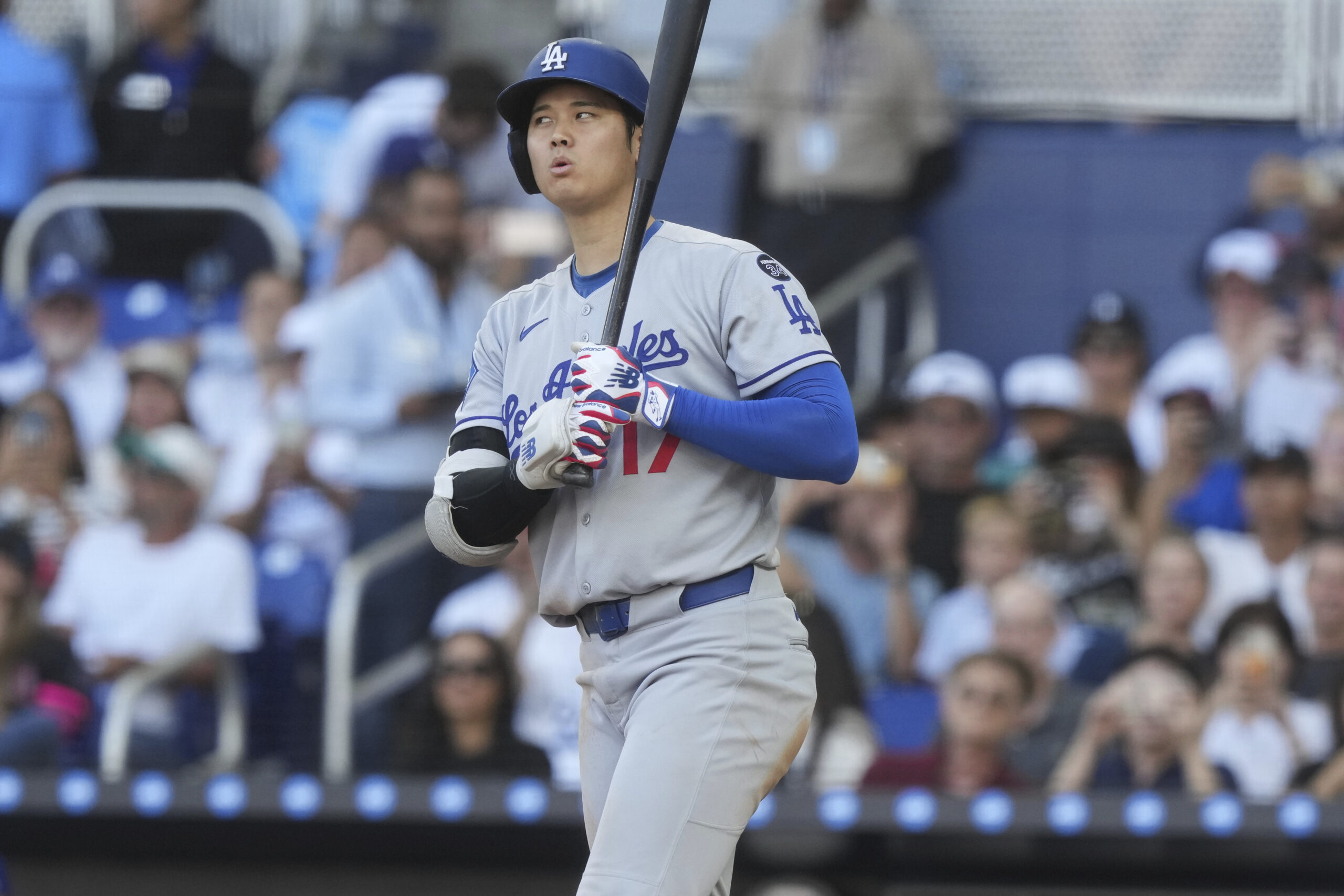 Dodgers star Shohei Ohtani reacts to a call while at...