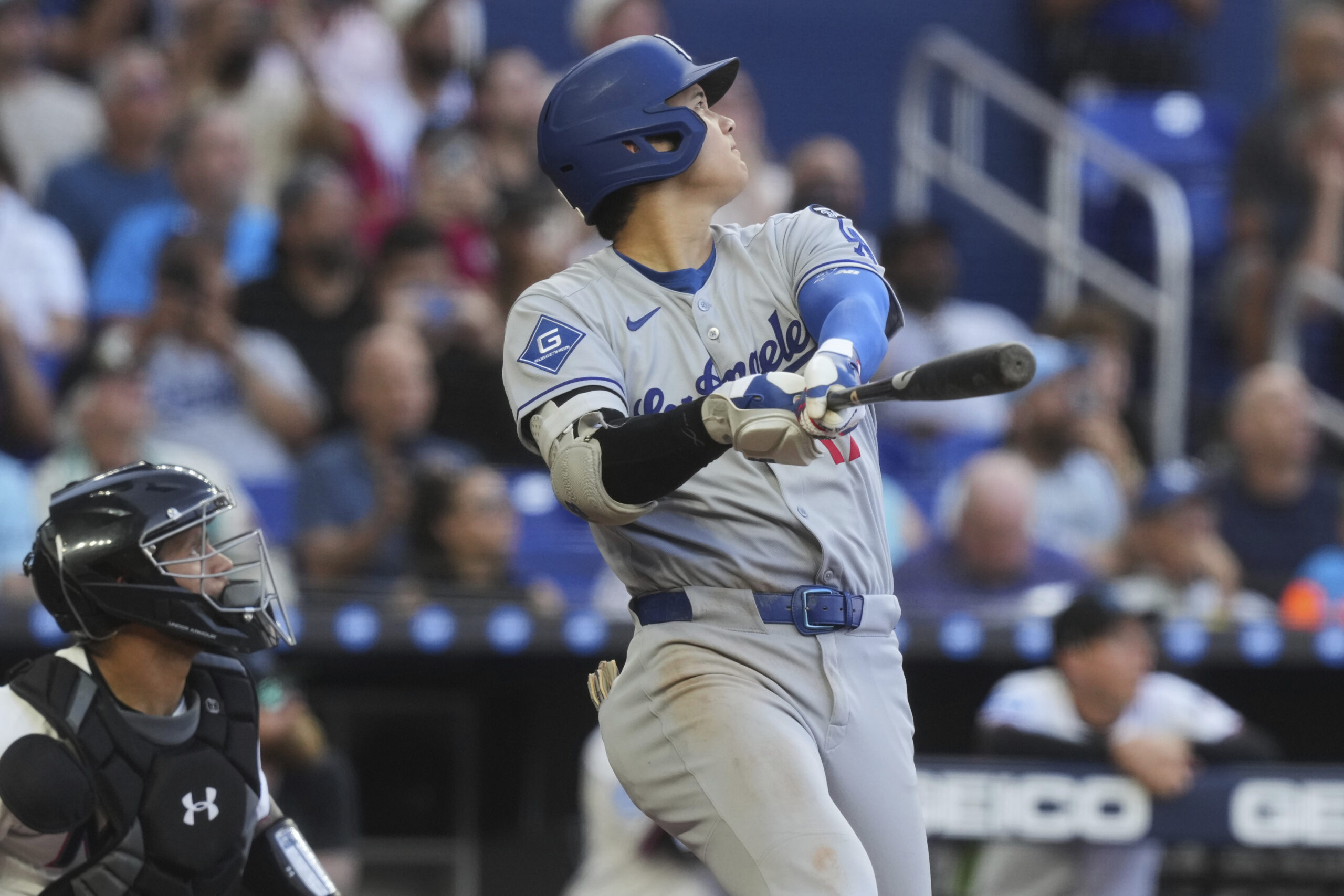 Dodgers star Shohei Ohtani hits a triple to right field...