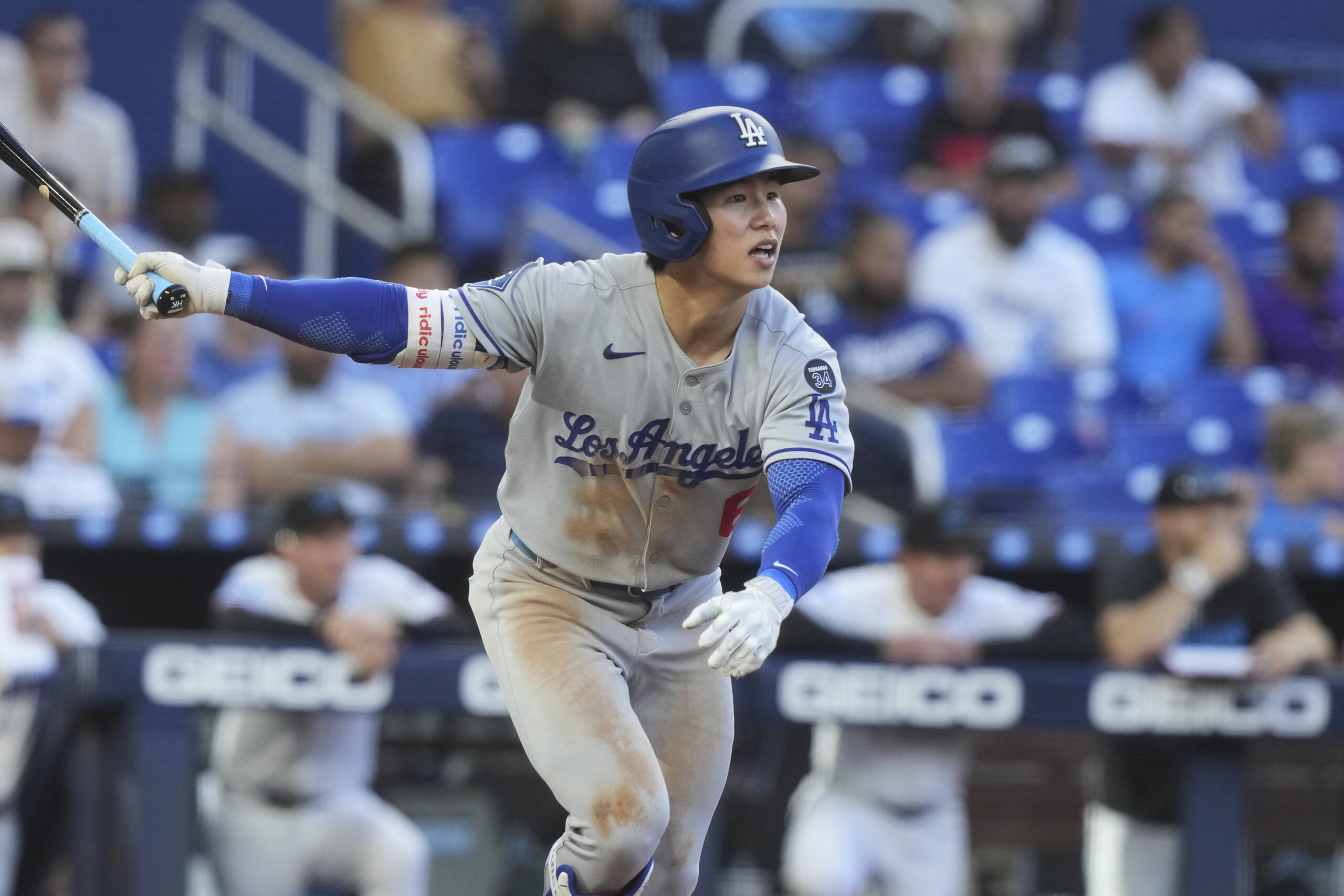 The Dodgers’ Hyeseong Kim hits a single during the eighth...