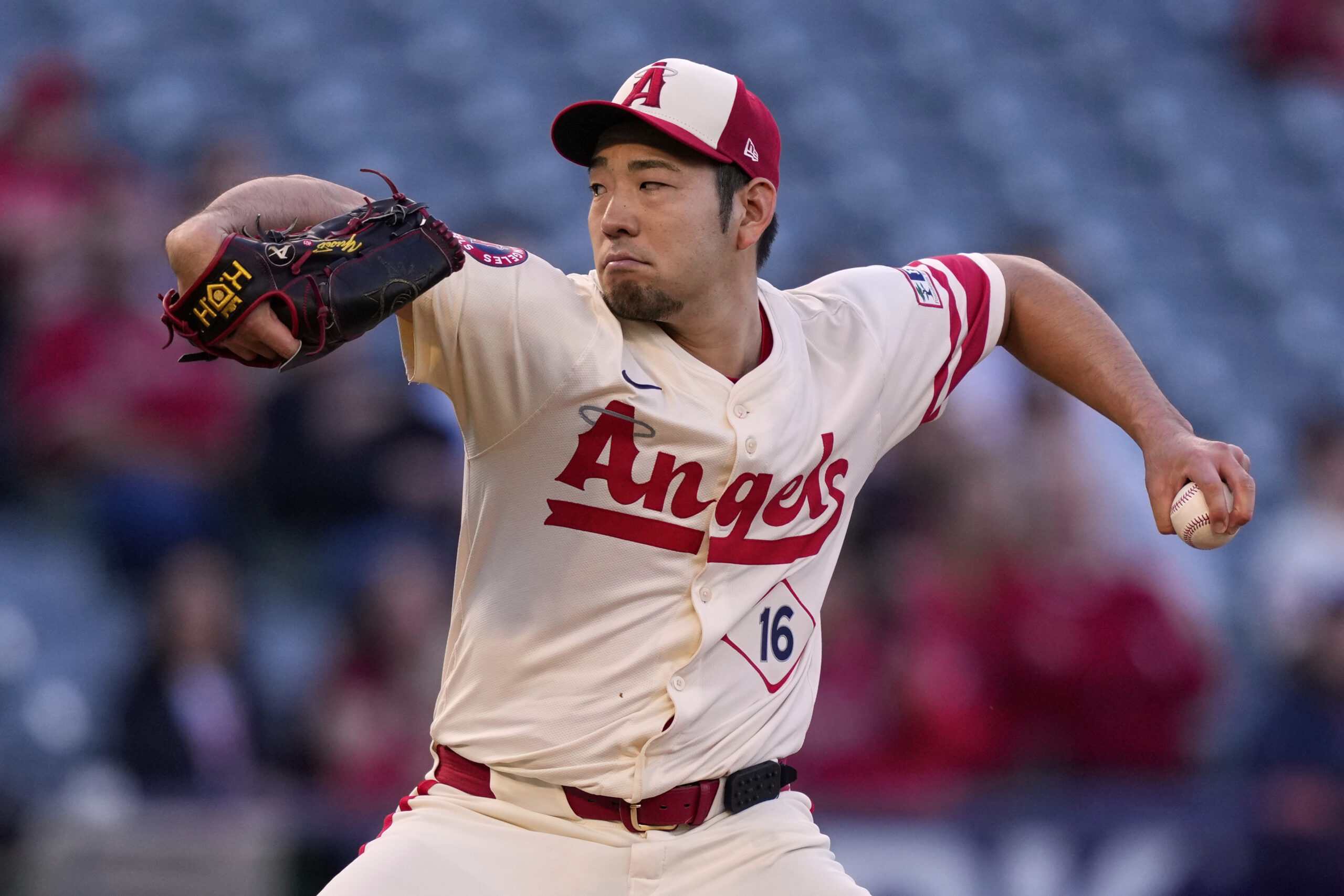 Angels starting pitcher Yusei Kikuchi throws to the plate during...
