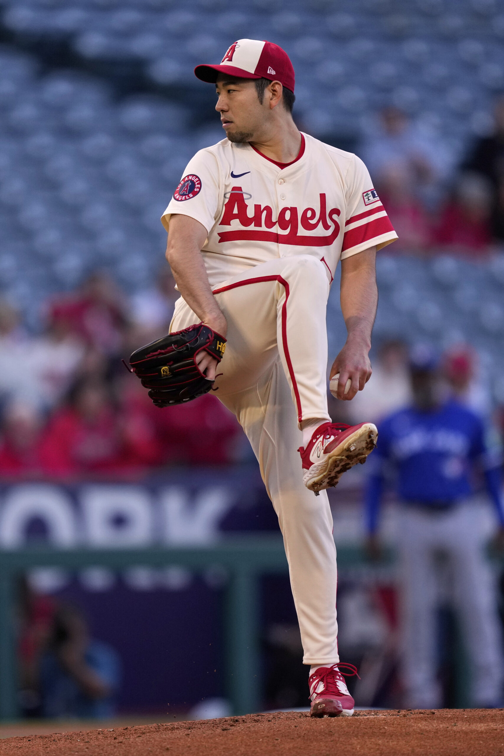 Angels starting pitcher Yusei Kikuchi throws to the plate during...