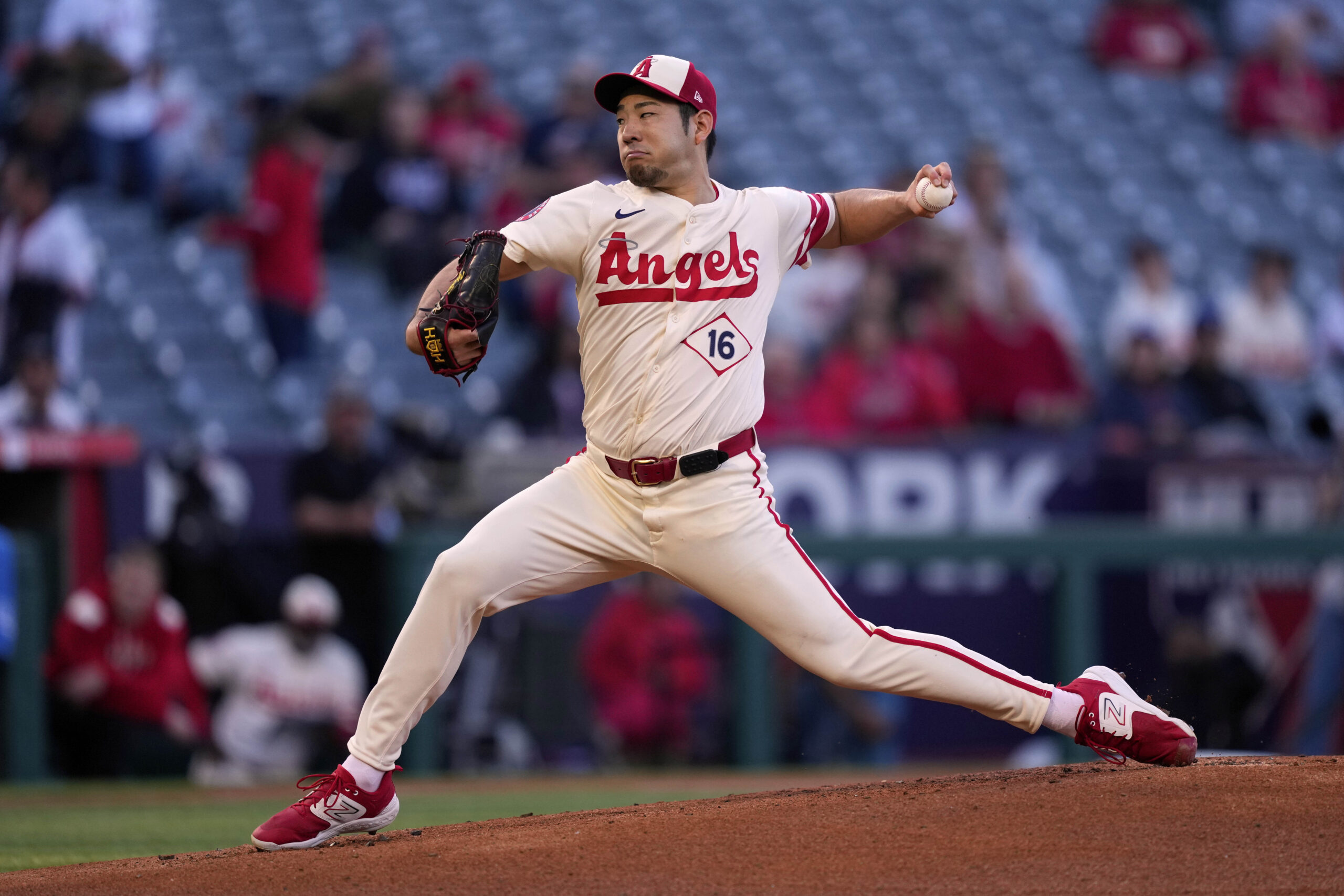 Angels starting pitcher Yusei Kikuchi throws to the plate during...