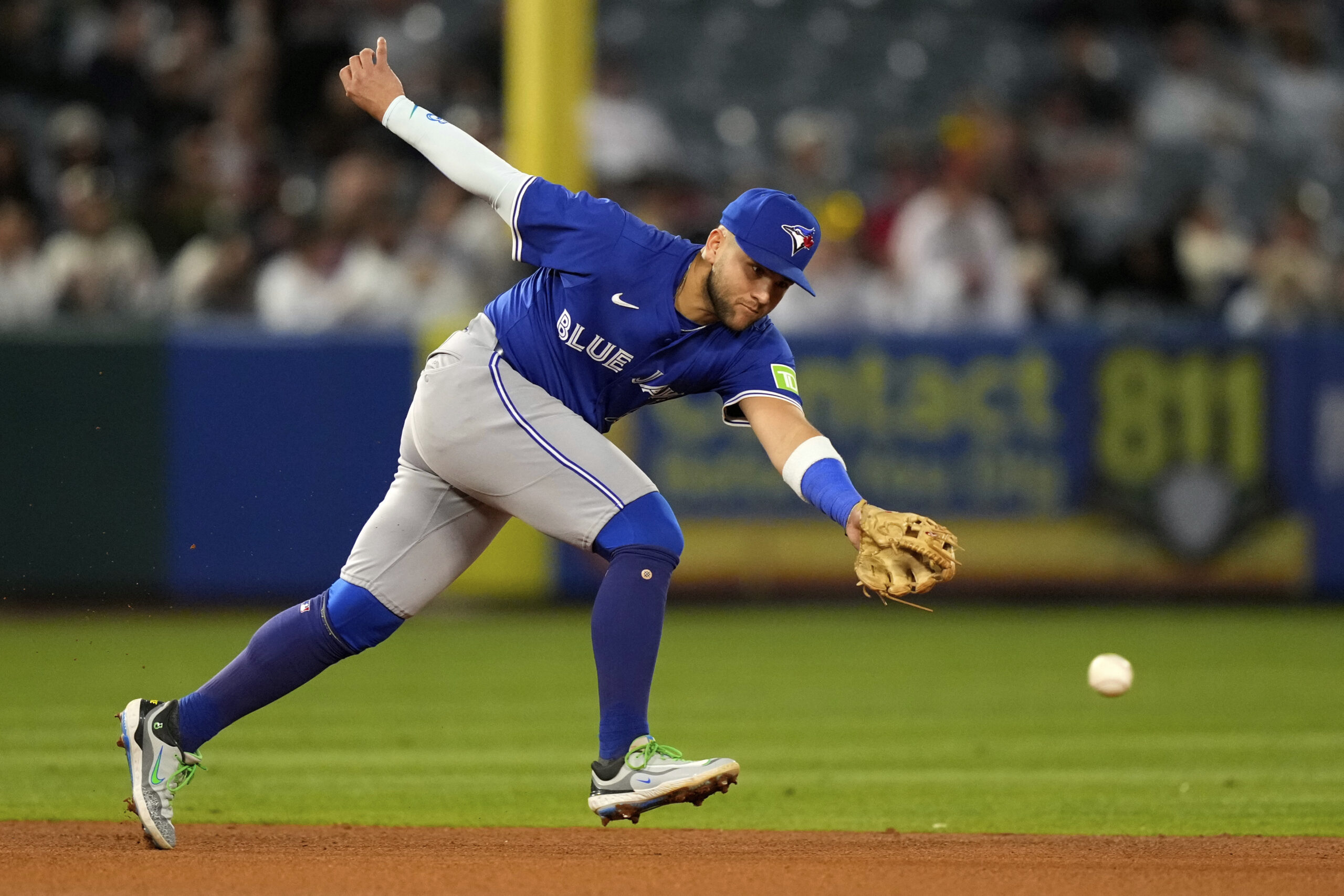 Toronto Blue Jays shortstop Bo Bichette can’t get to a...