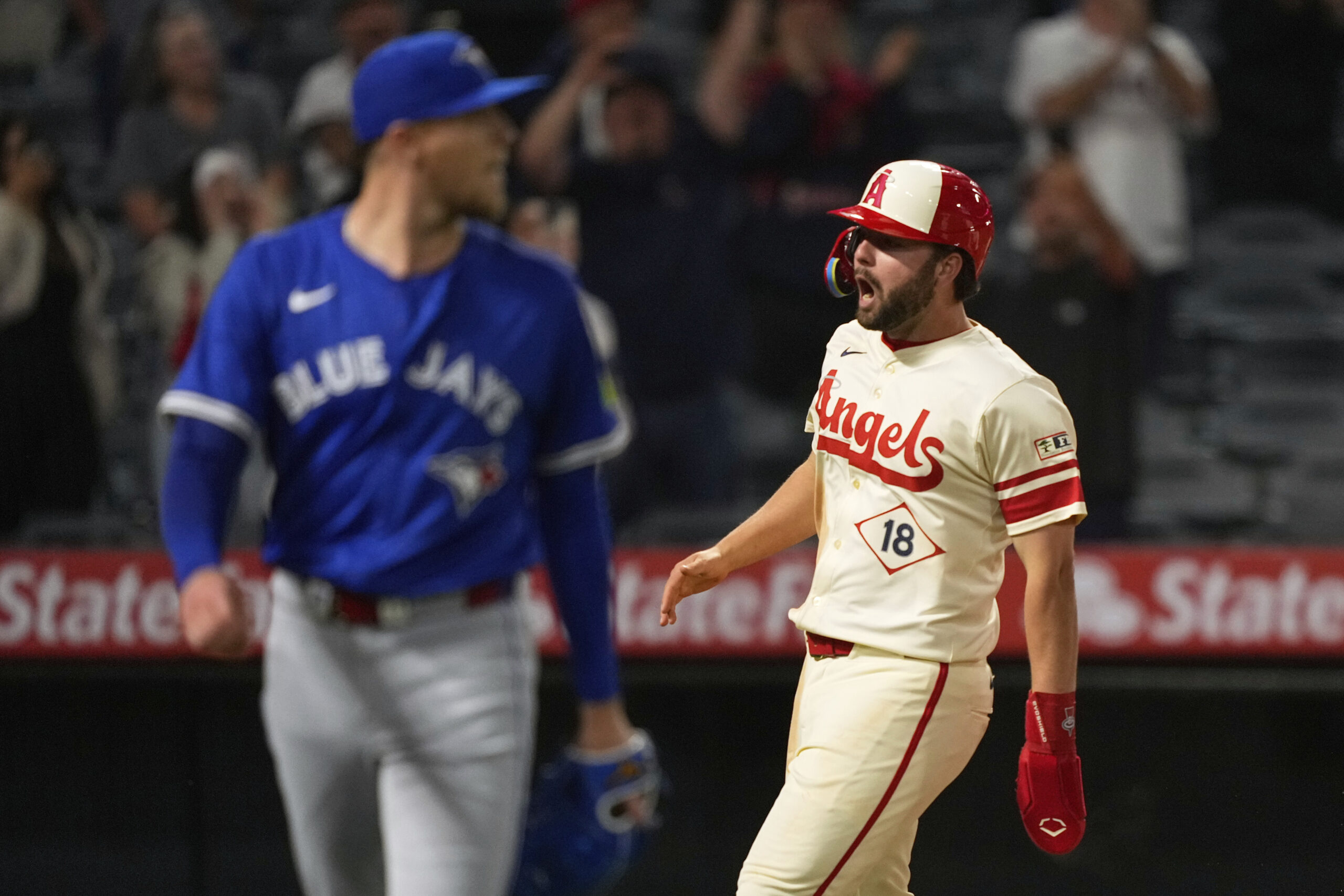 The Angels’ Nolan Schanuel, right, celebrates after scoring the winning...