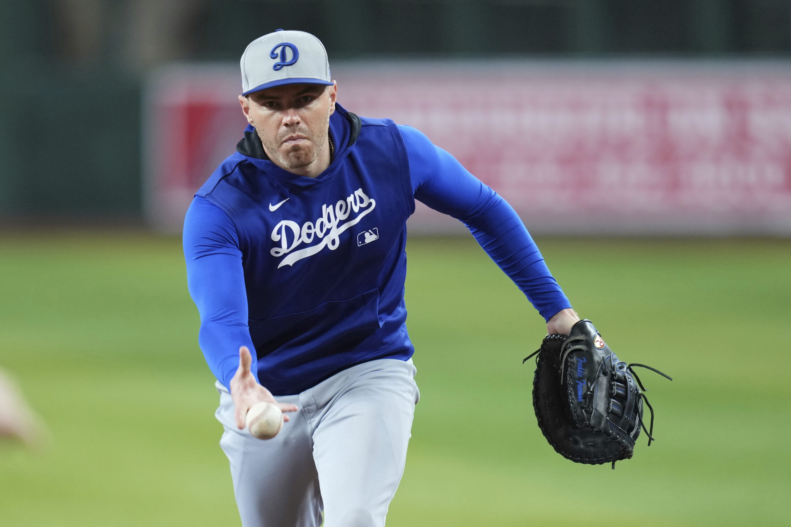 Dodgers first baseman Freddie Freeman warms up prior to a...