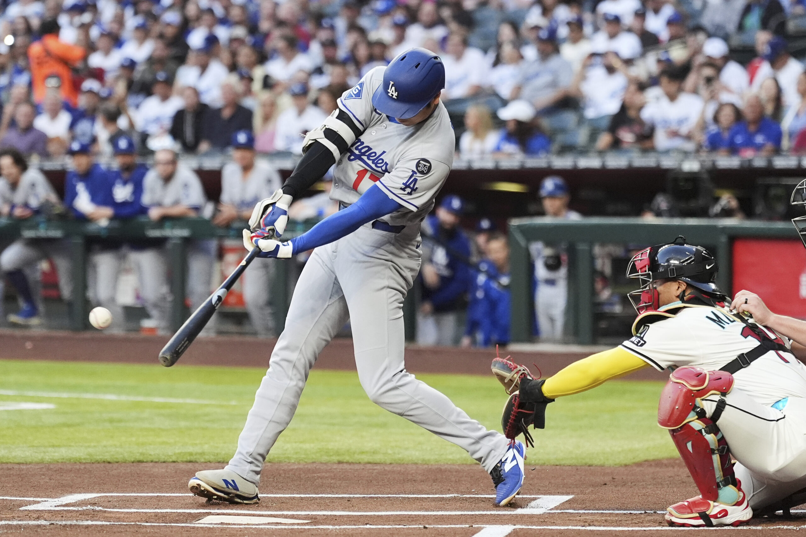 Dodgers designated hitter Shohei Ohtani hits a fly ball out...
