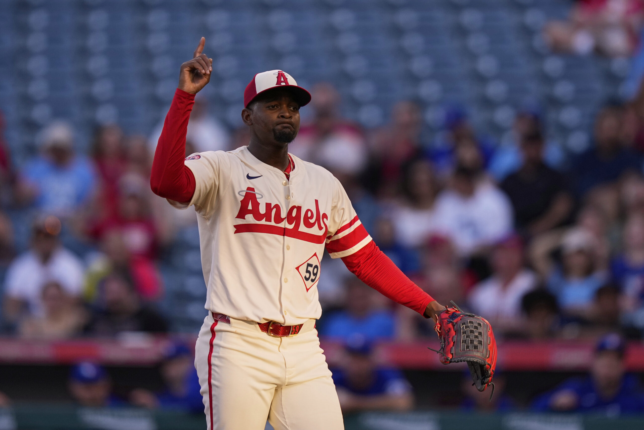 Angels starting pitcher Jose Soriano gestures after striking out the...