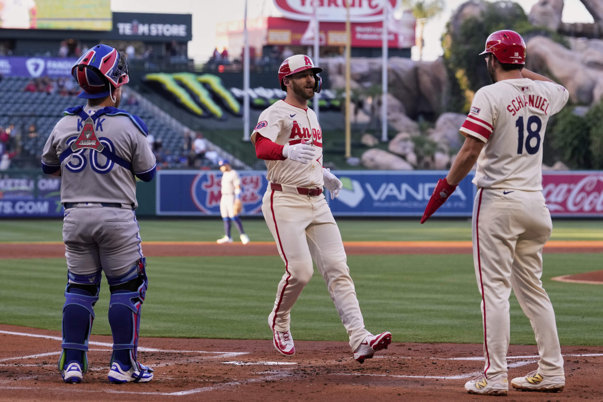 The Angels’ Taylor Ward, center, is congratulated by teammate Nolan...