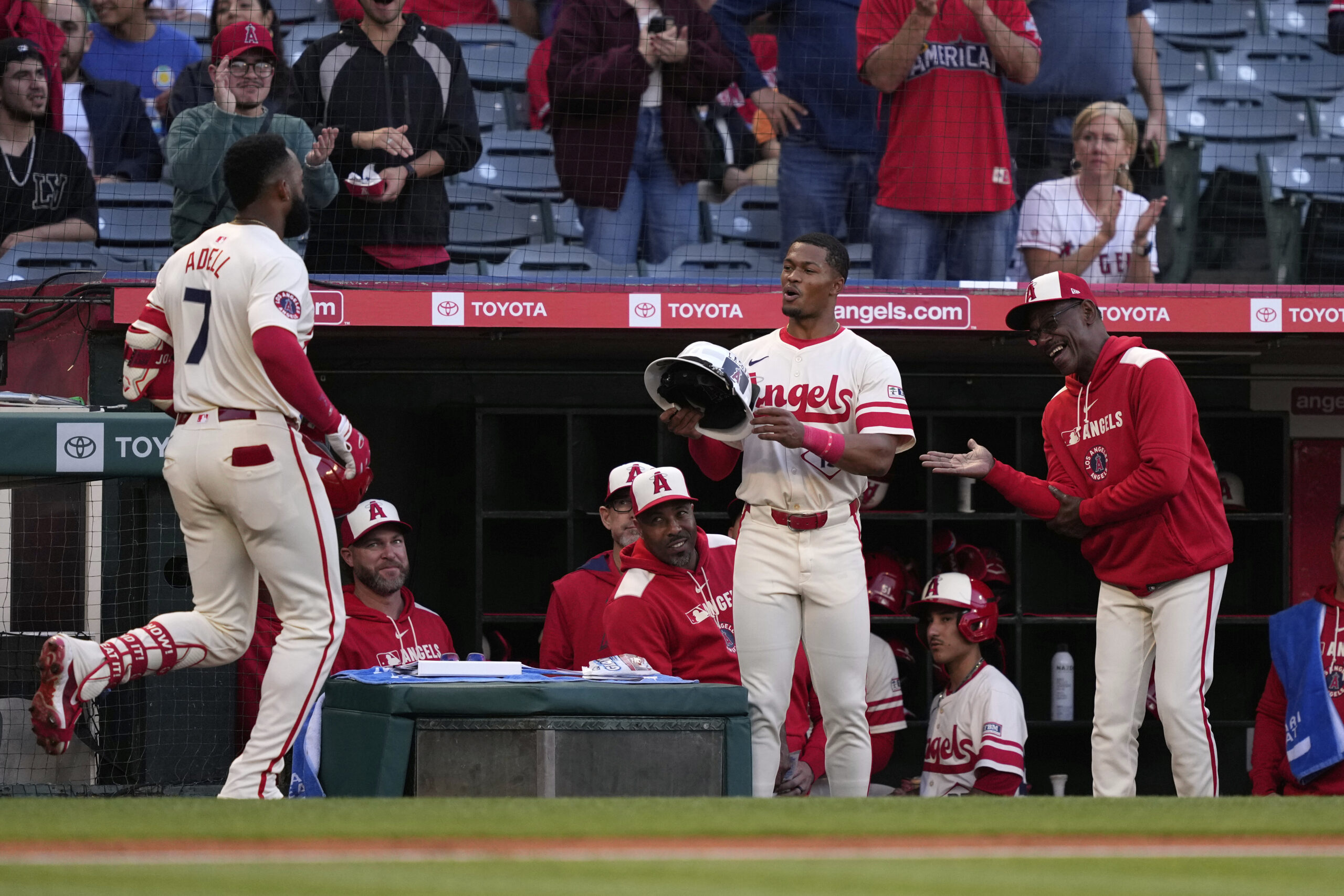 The Angels’ Jo Adell, left, is congratulated by teammate Kyren...