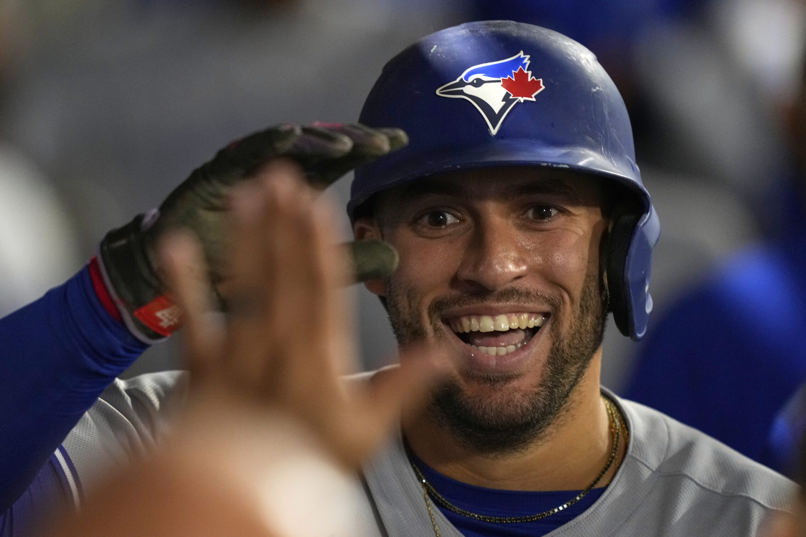 The Toronto Blue Jays’ George Springer celebrates with teammates in...