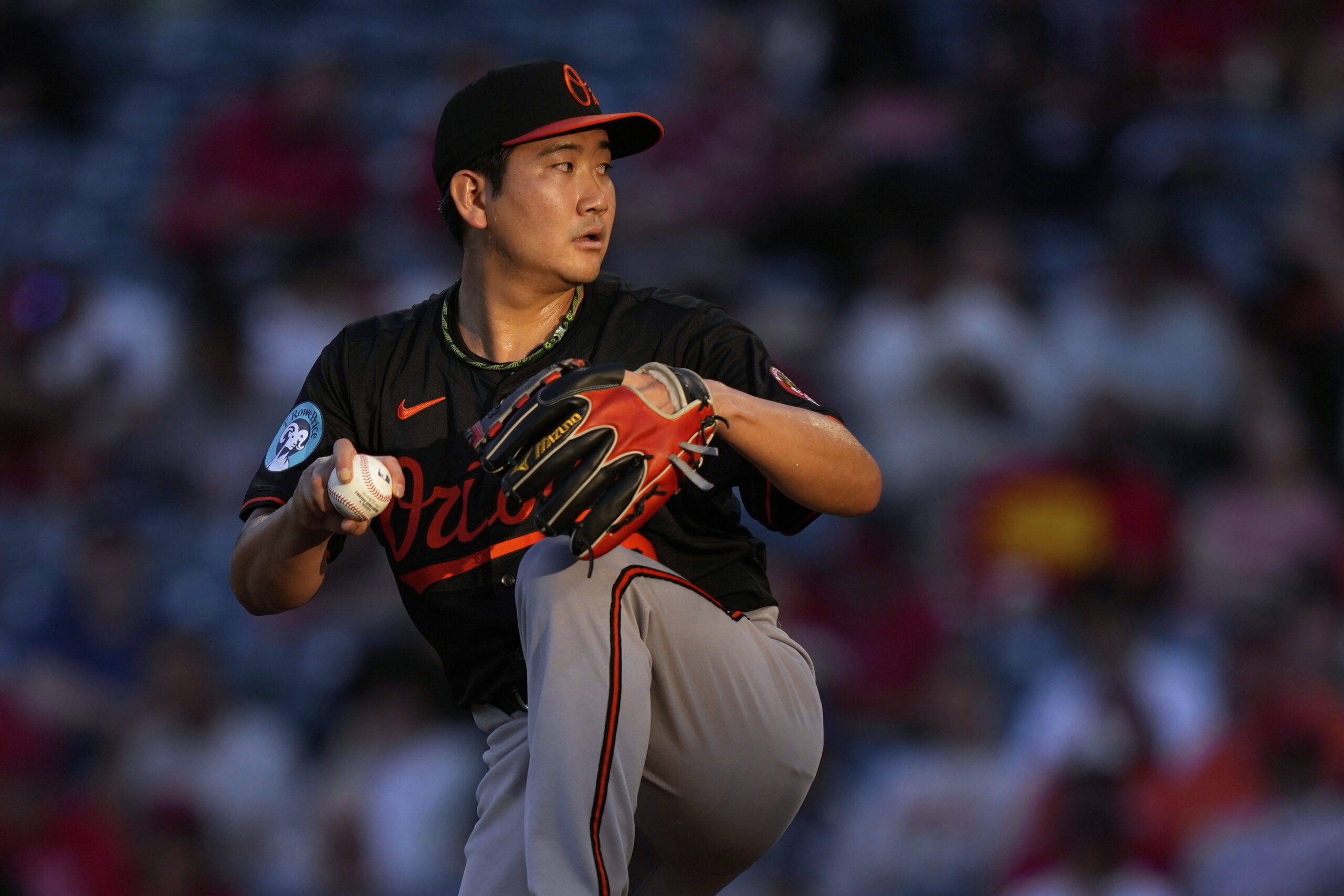 Baltimore Orioles starting pitcher Tomoyuki Sugano throws to the plate...