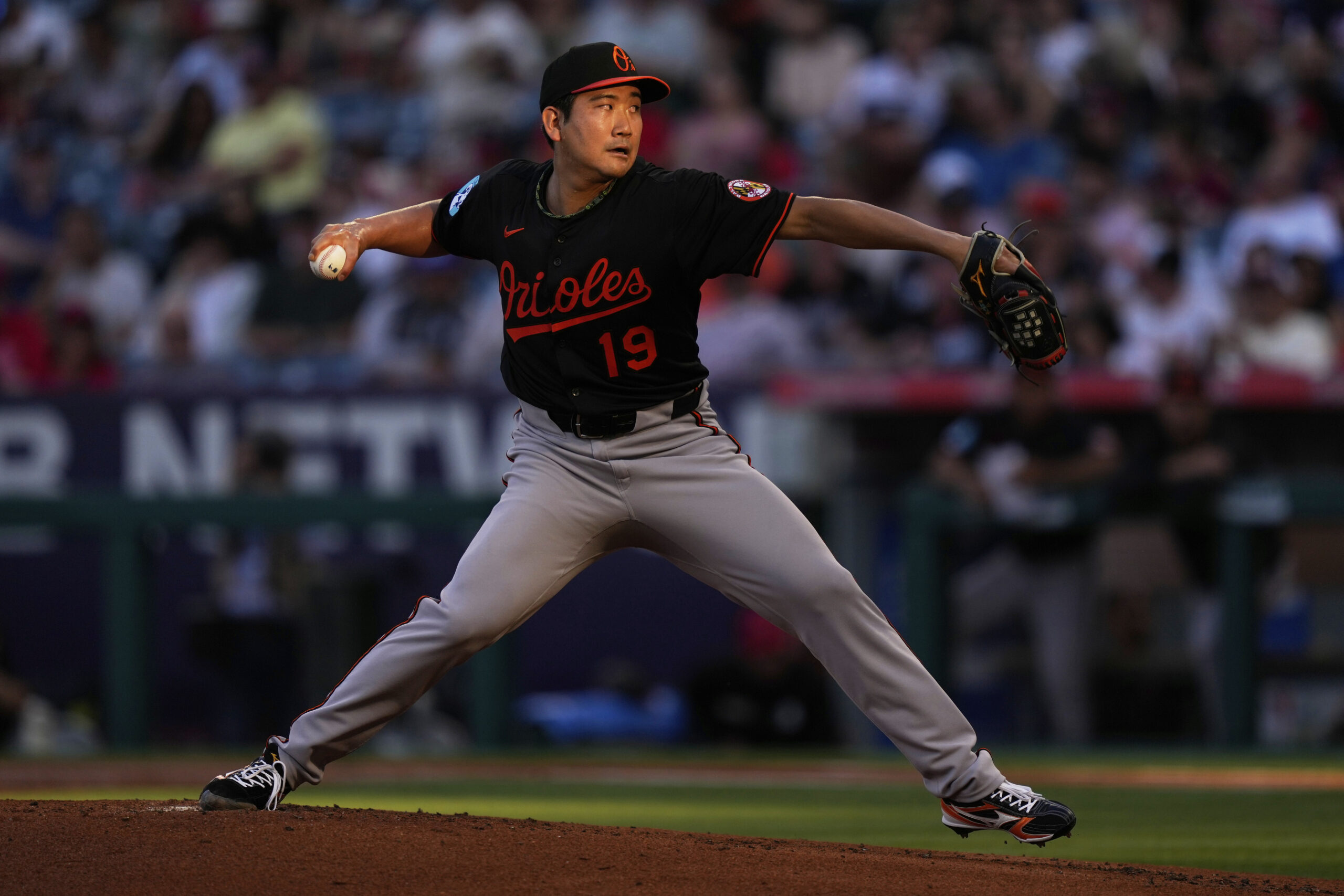 Baltimore Orioles starting pitcher Tomoyuki Sugano throws to the plate...