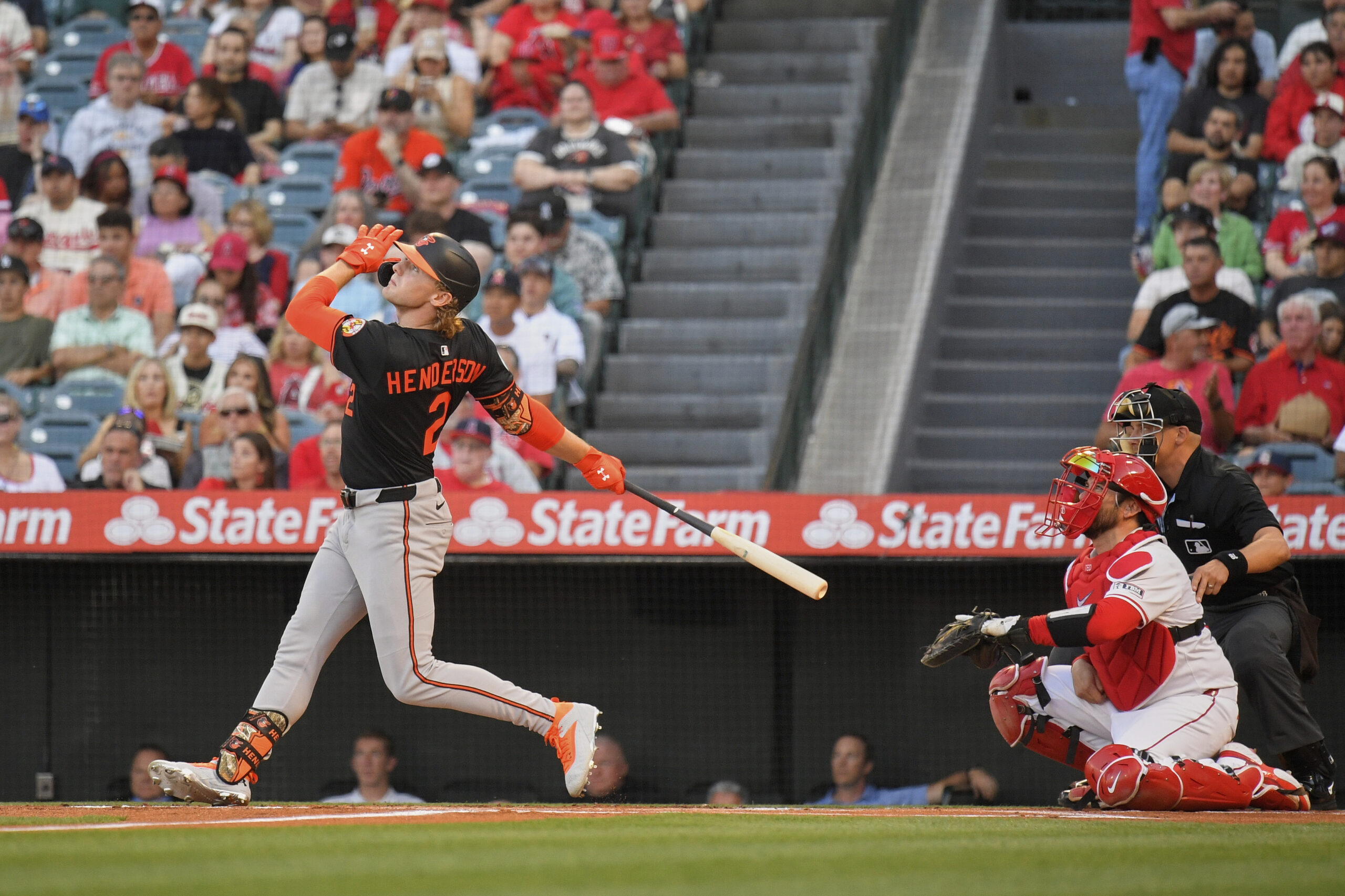 The Baltimore Orioles’ Gunnar Henderson, left, hits a solo home...