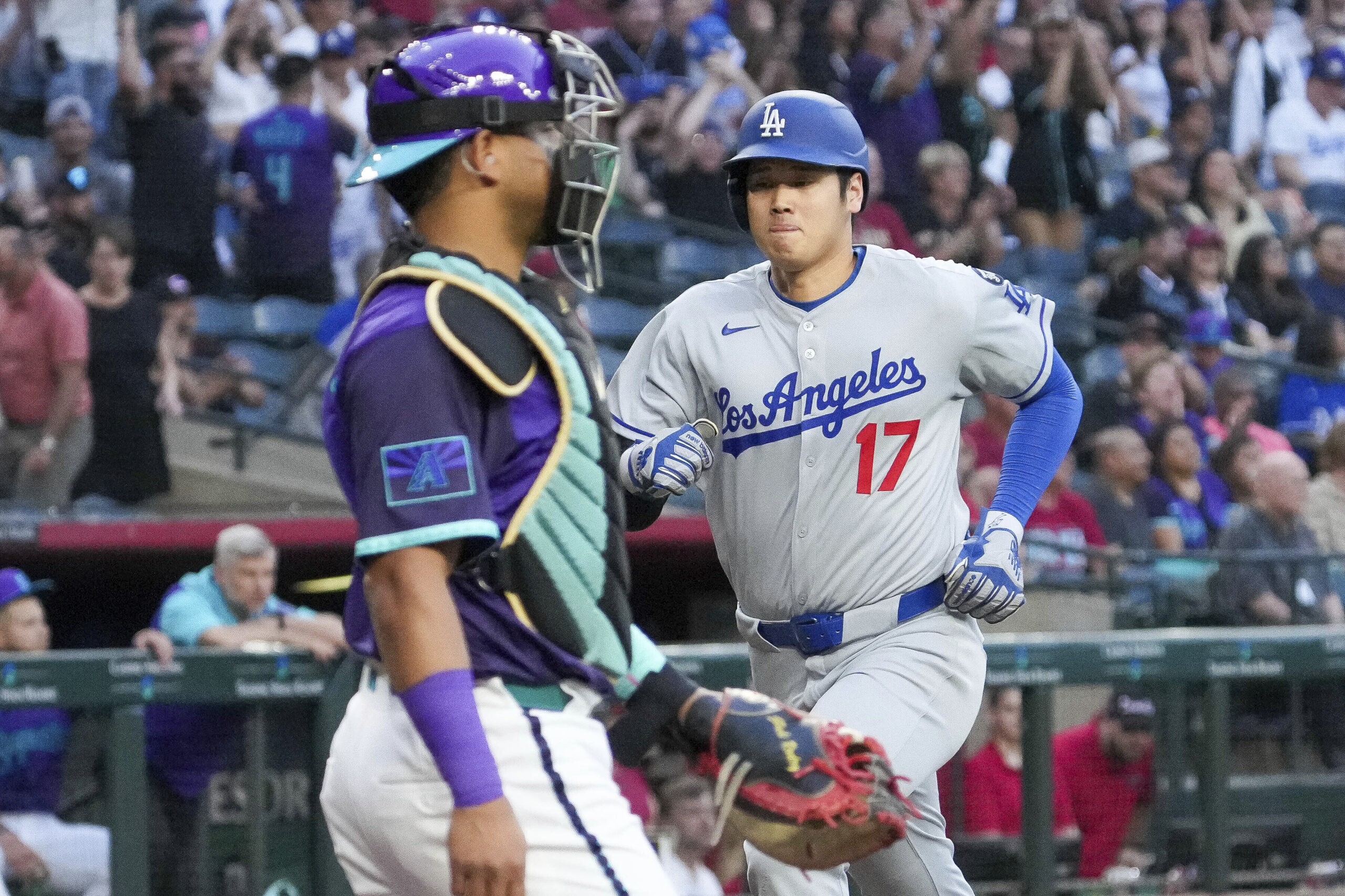 Dodgers star Shohei Ohtani scores the team’s first run in...