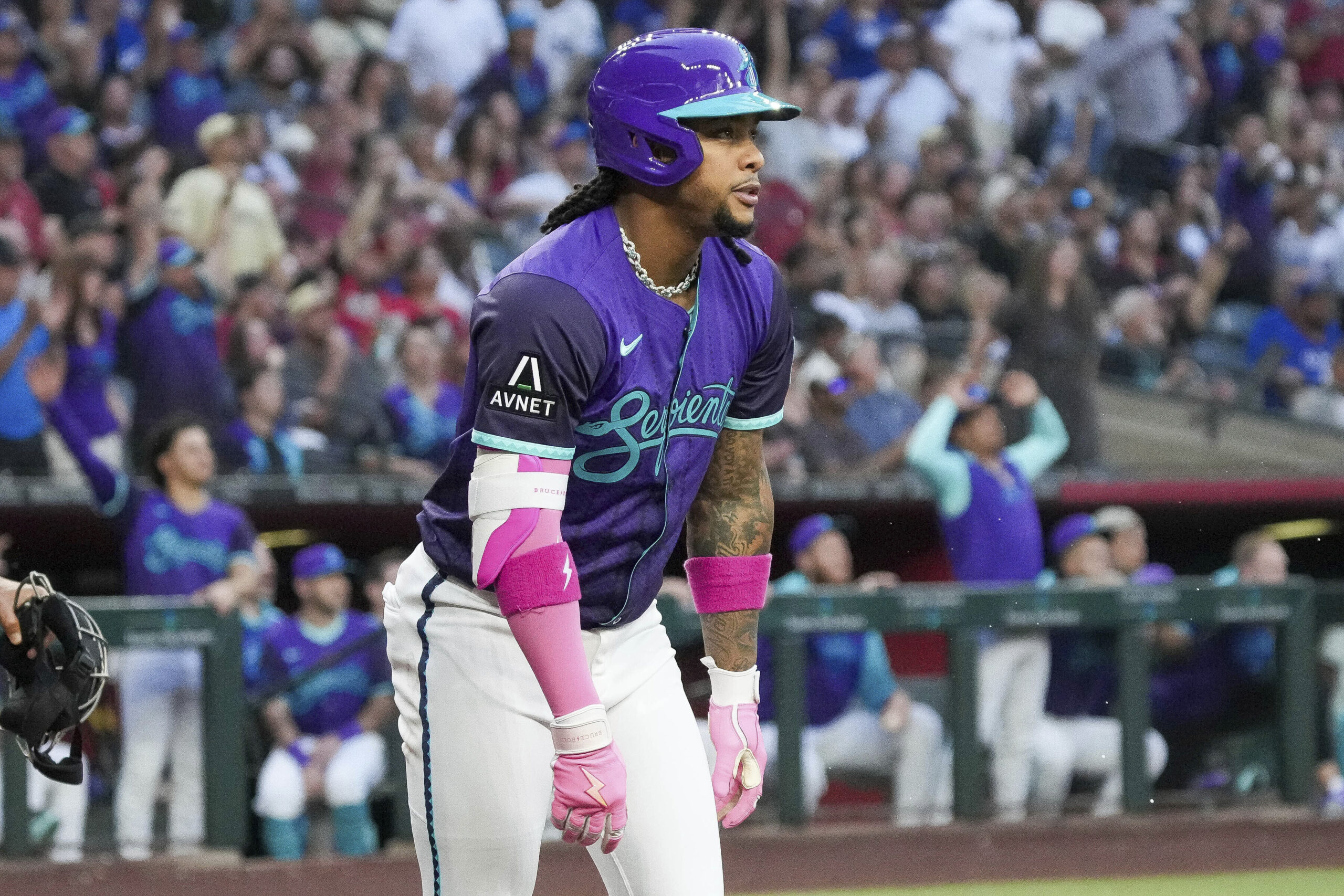 The Arizona Diamondbacks’ Ketel Marte watches the flight of his...